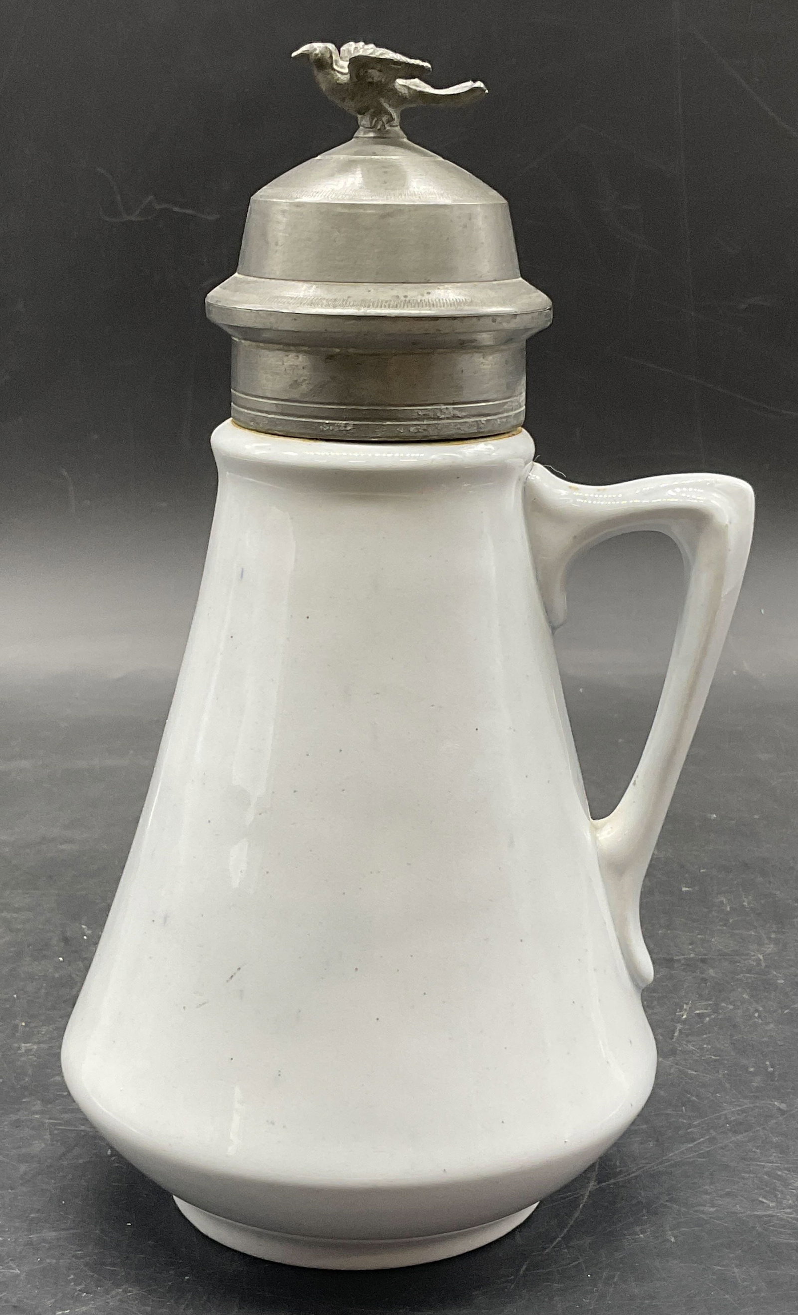 Vintage Ceramic & Metal Bird Motif Syrup Dispenser: Vintage Ceramic & Metal Bird Motif Syrup Dispenser. Bird figural to the hinged metal lid. Measures approx. 7.5H x 4W in. Measured at widest point. Underside of lid reads PAT JUL 16 72. Discoloration,