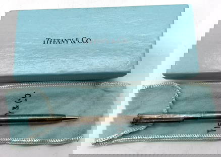 TIFFANY & CO Sterling Silver Ballpoint Pen W Box: TIFFANY & CO Sterling Silver Ballpoint Pen W Box Sterling silver ballpoint that features an engraving that reads E.P. Ballpoint pen comes with original box. Surface wear consistent to age, use, & expo