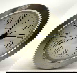 TIFFANY & CO. Round Desk Quartz Alarm Steel Clock: TIFFANY & CO. Round Desk Quartz Alarm Steel Clock Round desk steel Quartz alarm clock that features Swiss-made movements. Clock has visible roman numerals & reads TIFFANY & CO. Not tested for function