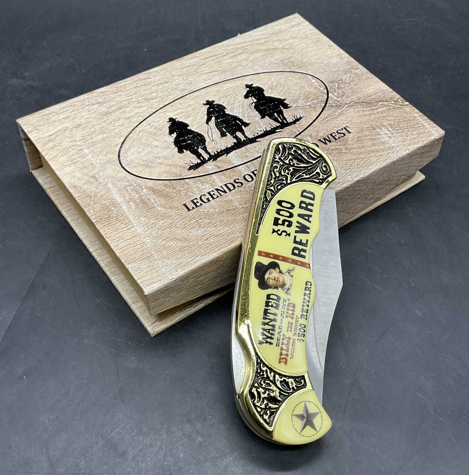 BILLY THE KID Portable Knife W/ Original Box: BILLY THE KID Portable Knife With Original Box. The knife features an image of Billy the Kid and verbiage. The knife is crafted from metal and composite materials, blade reads Stainless. Box reads Leg
