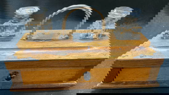 Vtg Double Glass Wooden Inkwell Stand W Drawer: Vintage double glass inkwell stand with drawer desk set. Double glass inkwell desk set, wood box with a single drawer, applied metal accents on top, incorporated pen tray. Two glass inkwells with lids