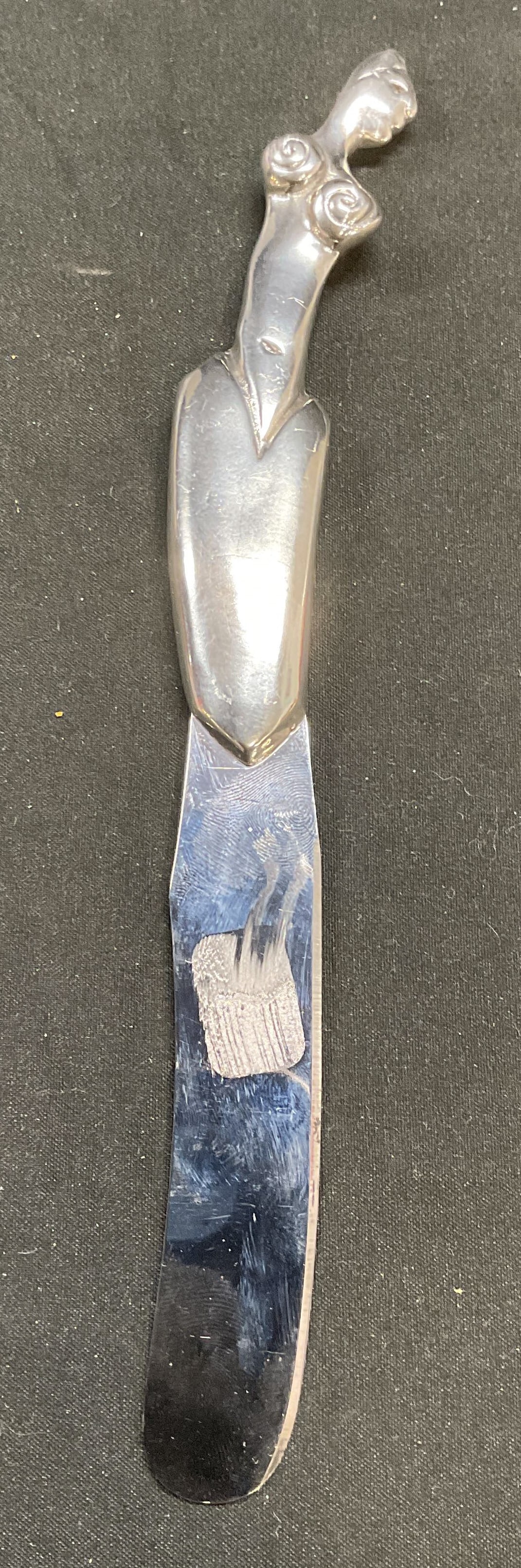 Carol Boyes Pewter Woman Knife, S. Africa: Carol Boyes pewter and stainless steel knife. Figural woman motif handle with coiled detail. Signed. Made in South Africa. Measures approx 8.25 inches long. Some scratching. Carol Boyes, Carol Boyes k