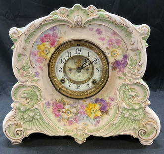 ANSONIA La Corsica Royal Bonn Porcelain Clock: Antique ANSONIA La Corsica Royal Bonn porcelain clock. Ornate French design with curved body for embellishes with yellow and pink roses. Embossed with green griffin. Scroll and shell decorations. Sign