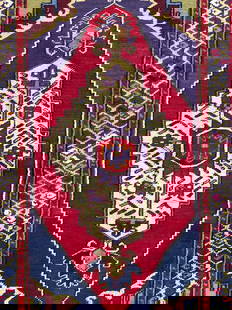 Vintage Handmade Persian Wool Area Rug: Rug is handmade and wool. Piece has intricate multi toned geometric detail. Rug is vintage, piece appears to be Persian. Rug has short cream tone fringes at edges. Measures approximately 59 inches lon