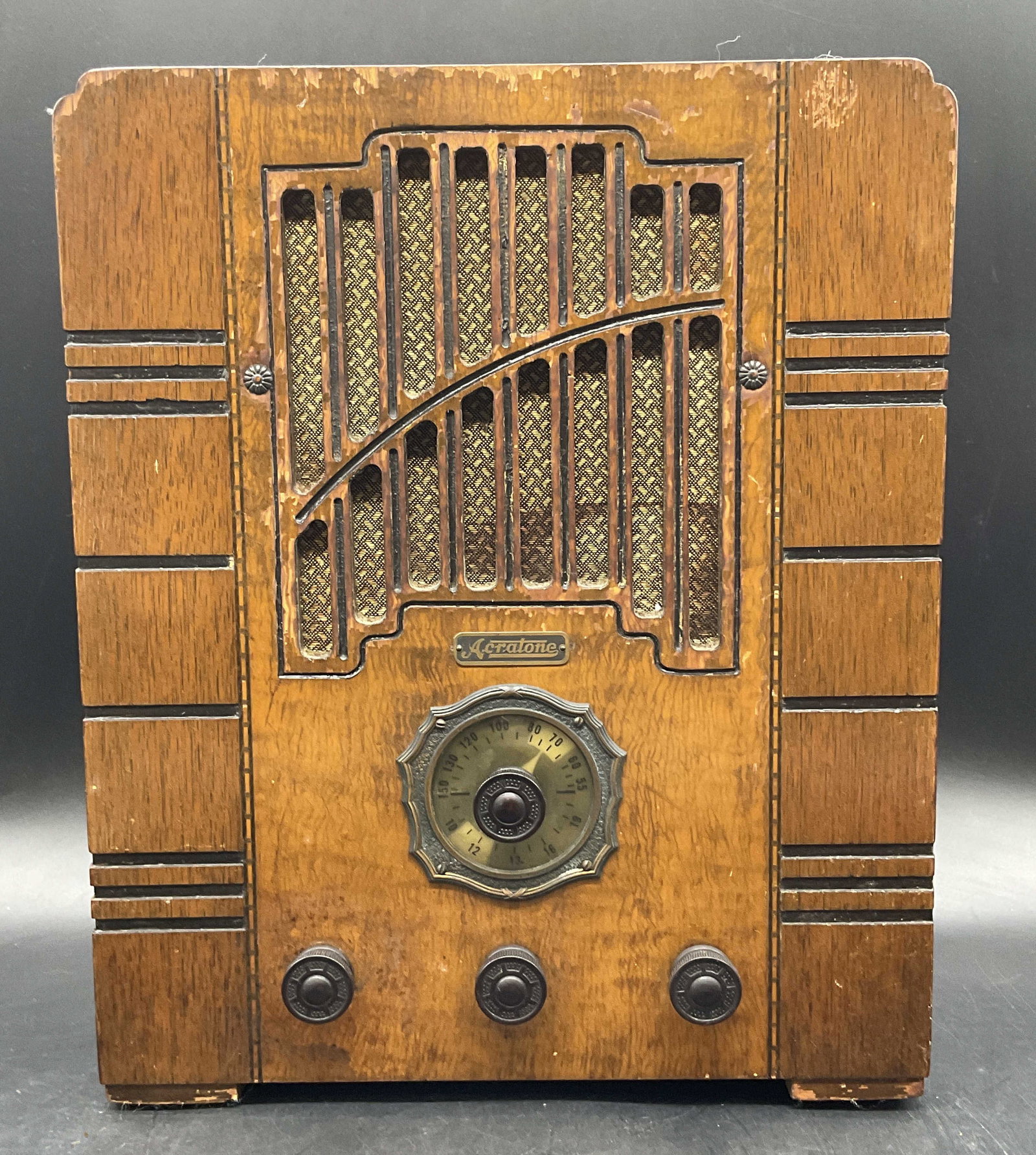 Vintage Acratone Tombstone Radio: Vintage Acratone Tombstone Radio. Crafted from wood, metal, rubber, and other materials. Measures approx. 13.5H x 11W x 6.5D in. Reverse plaque reads Superheterodyne Receiver Model No. 570, Serial Num