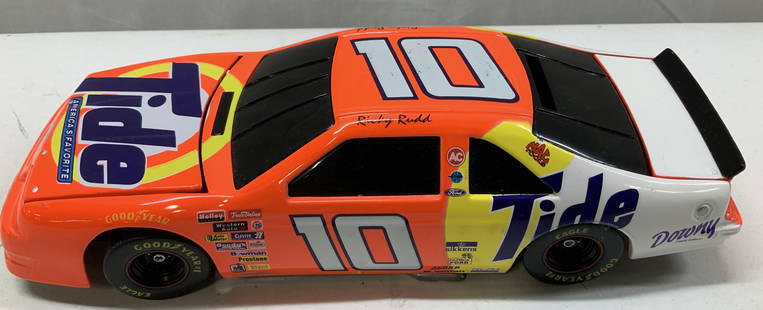 NASCAR 1997 Ricky Rudd #10 1:62 Die-Cast Metal Car: NASCAR 1997 Ricky Rudd #10 1:62 Die-Cast Metal Car Die-cast metal model car featuring #10 Ricky Rudd tide ford thunderbird NASCAR race car from 1997. Car is a vibrant orange color & has various logos.