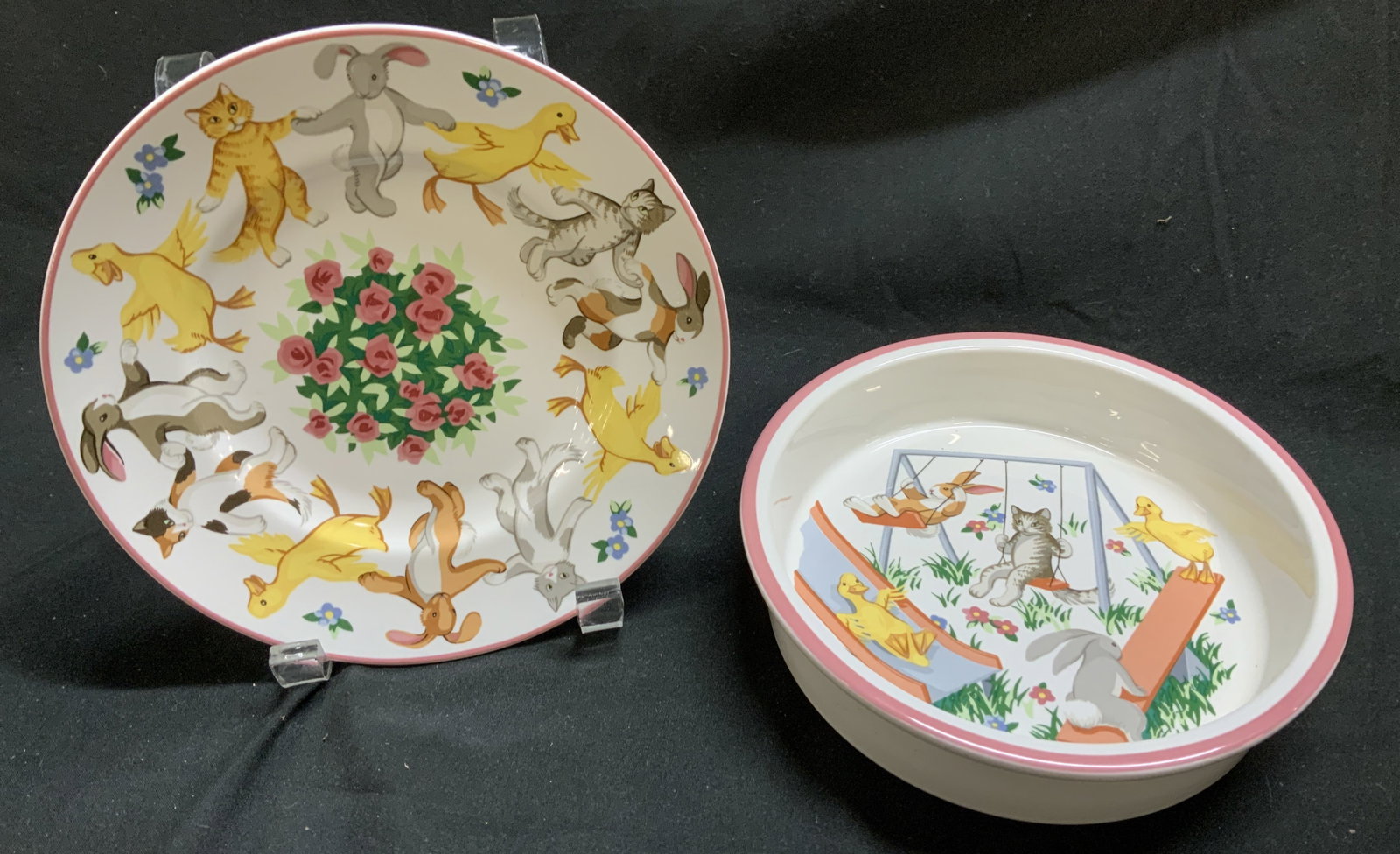 1992 TIFFANY&CO. Playground Plate & Bowl JAPAN: Lot includes 1 porcelain bowl & 1 plate. Pieces feature a playful pattern of animals, including bunnies, cats & ducks. Plates have floral patterns & a dark pink rim. Signed & marked on underside. Read