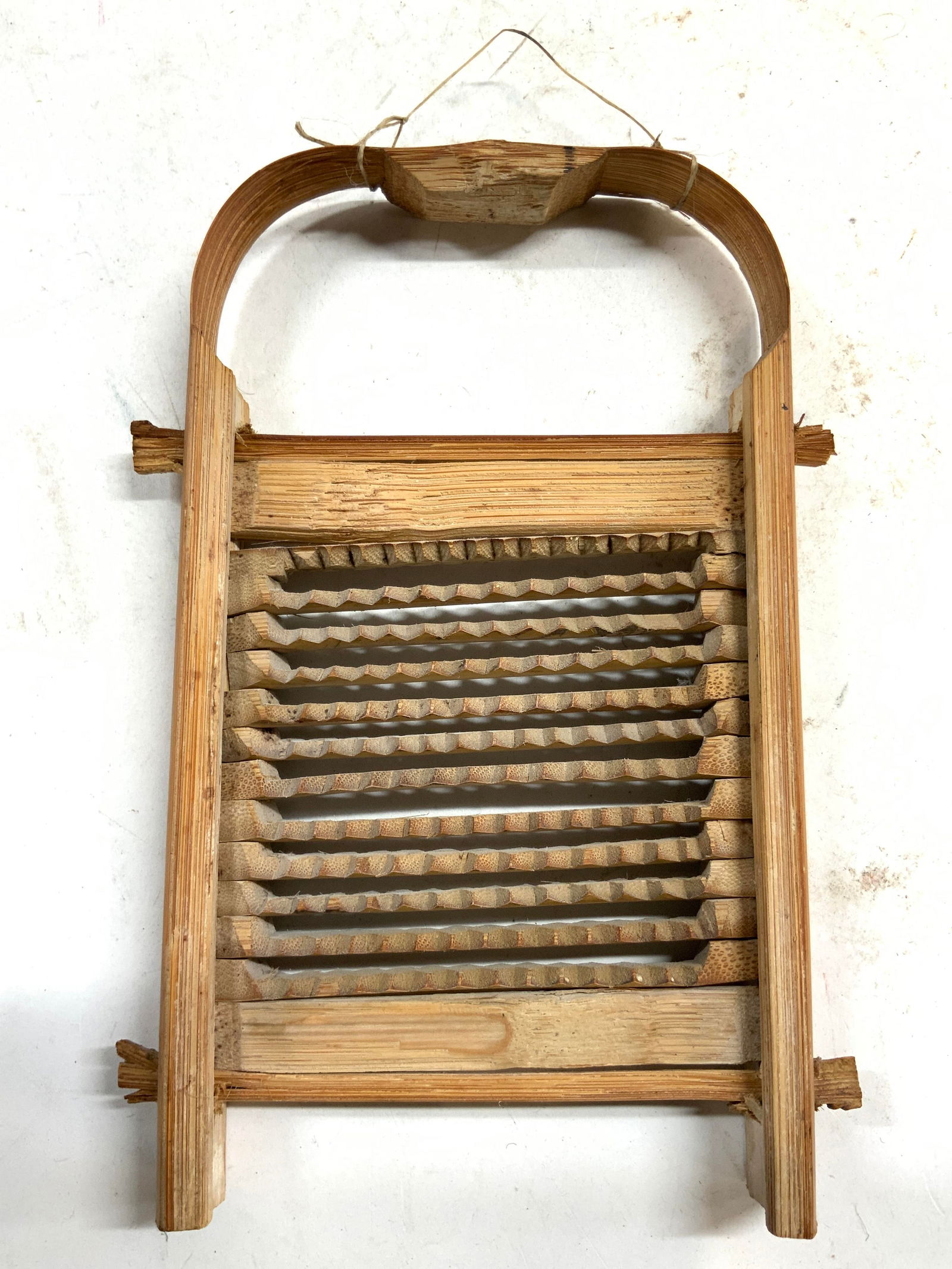 Antq Wooden Salesman Sample Washboard / Grater: Appears to be a salesman sample washboard or an Asian root grater. Salesman sample is Antique. Piece is antique and wooden. Washboard has pointed tooth scrubber. Top of piece has handle and string to