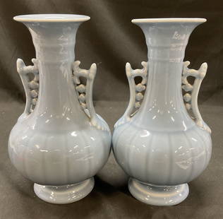Set 2 Light Blue Chinese Ceramic Celadon Vases: Set 2 light blue Chinese ceramic celadon vases. Pair of light blue glazed ceramic celadon vases with decorative handles. 9.25 x 5.5 inches. CHINA signed on underside. Some surface wear consistent with