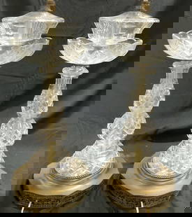Pr Vtg Crystal Table Lamps W Gilt metal Bases: Lot includes 2 lamps. Each are crystal with geometric relief detail. Lamps each have gilt metal bases with relief detail. Each lamp has gold toned harp and finial. Lamps each measure approximately 31