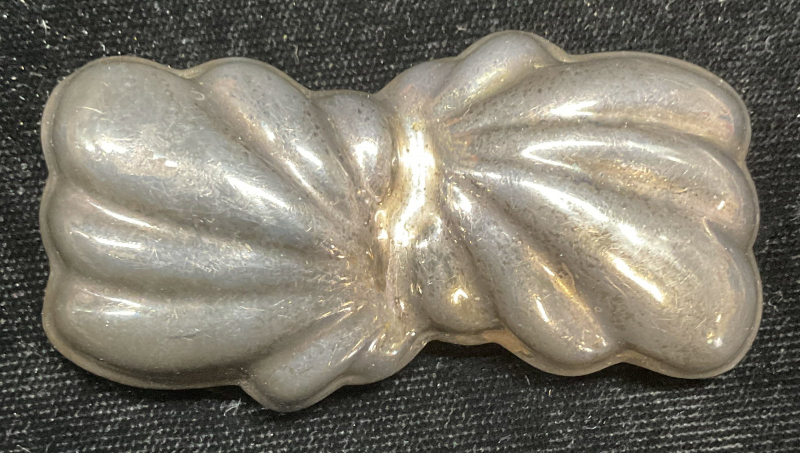 Vintage Sterling Silver Scalloped Brooch, Mexico: Vintage sterling silver scalloped motif brooch. Made in Mexico. Marked sterling. Measures approx 1 x 2.5 inches. Total weight 24 grams. Some wear including scratching observed. Jewelry, estate jewelry