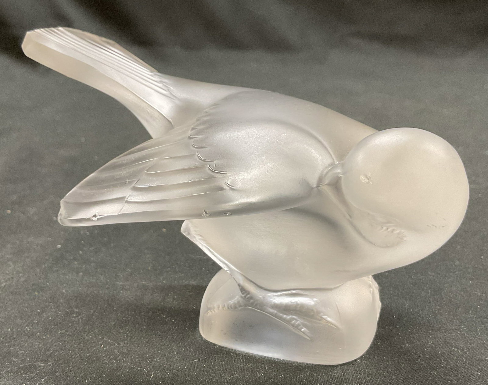Lalique Moineau Coquet Bird Glass Figurine France: Lalique Moineau Coquet bird glass figurine. Made in France. French Crystal art glass sculpture of a sparrow. Signed on underside. 4.5 x 3 x 3 inches. Some surface wear consistent with exposure, Slight