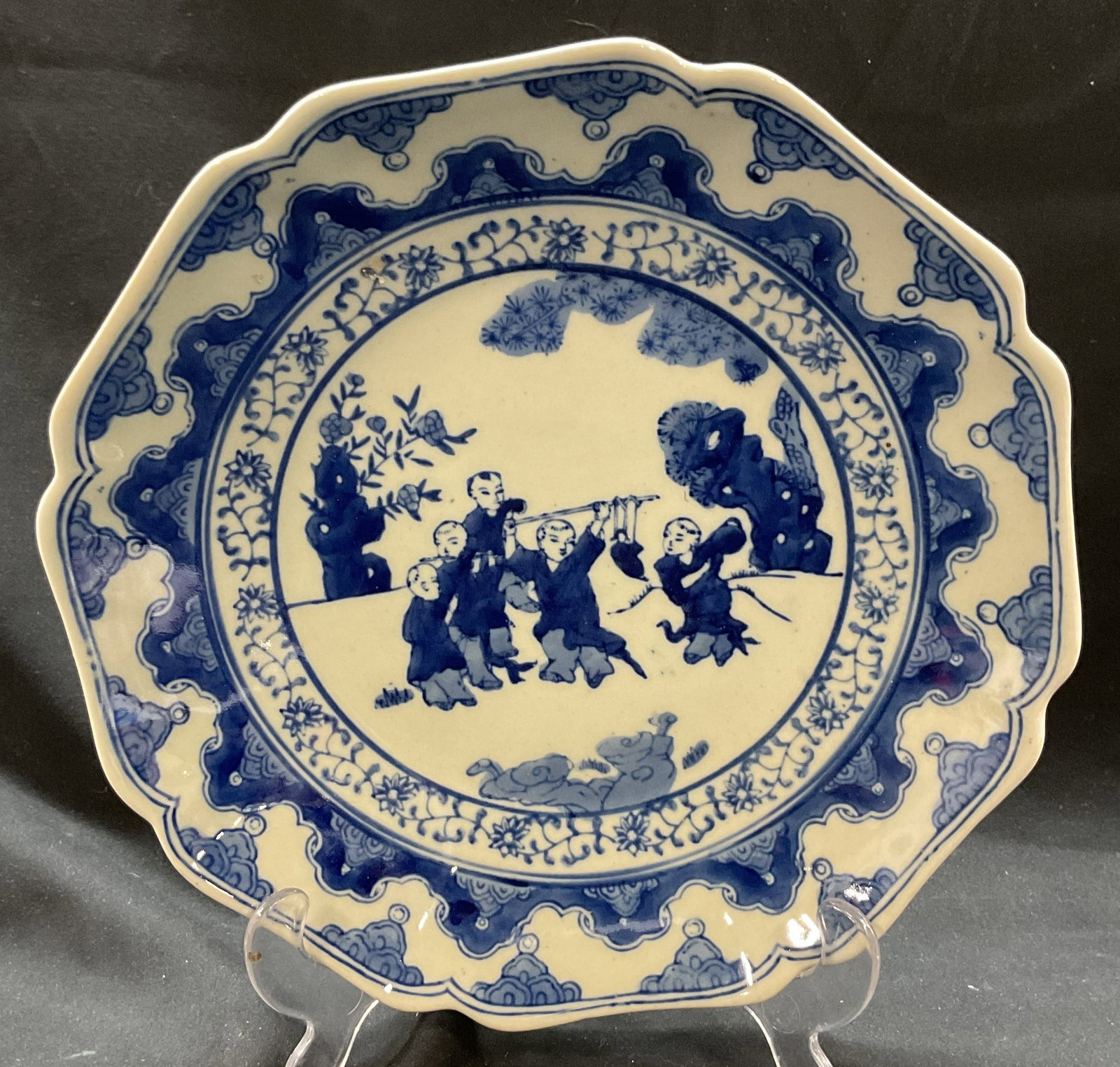 Vtg Chinese Blue White Porcelain Plate: Vintage Chinese blue white porcelain plate. Chinoiserie style Scalloped, lobed rim with underglaze blue. Decorated with scene of children playing. Signed on underside with Asian characters. Some surfa