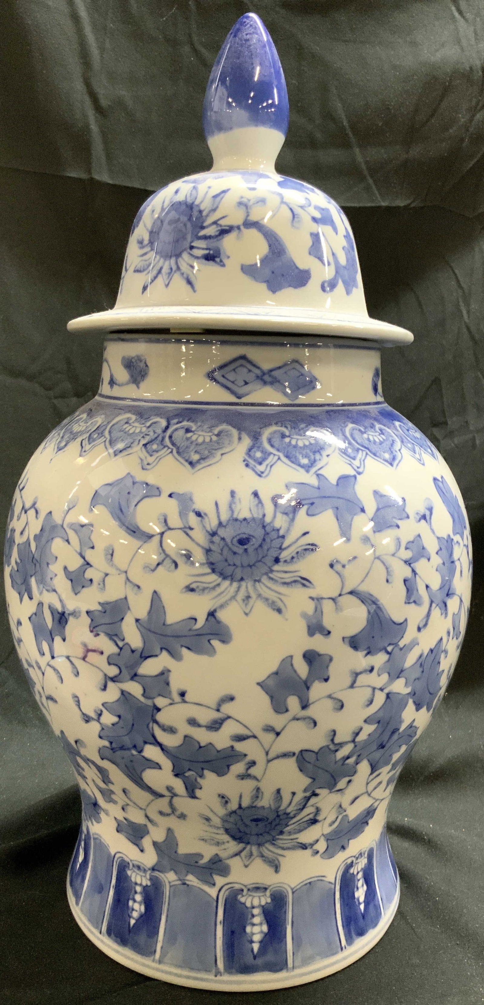 THE CANTON COLLECTION Asian Prc Ging Jar W Lid: Tag on Underside reads THE CANTON COLLECTION. Ginger jar is white toned and porcelain with blue toned floral, leaf, vine and geometric detail. Jar includes lid. Appears to possibly be hand painted. Gi