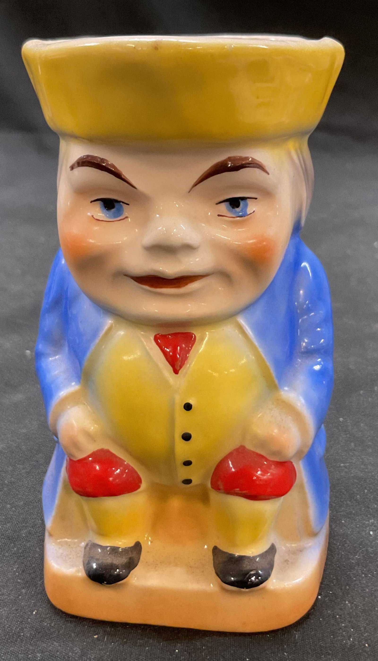 Vtg Porcelain Hand Painted Toby Mug Creamer Czech: Vintage porcelain hand painted Toby mug creamer. Toby mug depicting a colonial man or statesman. Miniature creamer or Toby mug. Made in Czechoslovakia. Also marked 38. 4 x 2.5 x 4.25 inches. Some surf