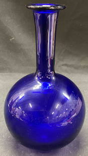 Vtg Cobalt Blue Bottle Blown Glass Vase: Vintage cobalt blue bottle blown glass vase. Round body, slim neck vase in solid cobalt blue color. 9 x 4.5 inches. Some surface wear consistent with exposure. Cobalt blue vase, glass vase, round glas