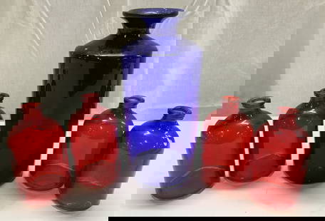 Group Lot Vintage Red & Cobalt Blue Glass Bottles: Group Lot Vintage Red & Cobalt Blue Glass Bottles 4 small vintage red mini bud vase & one large cobalt blue glass bottle. They have a cylindrical shape. Surface wear consistent to age, use & exposure.