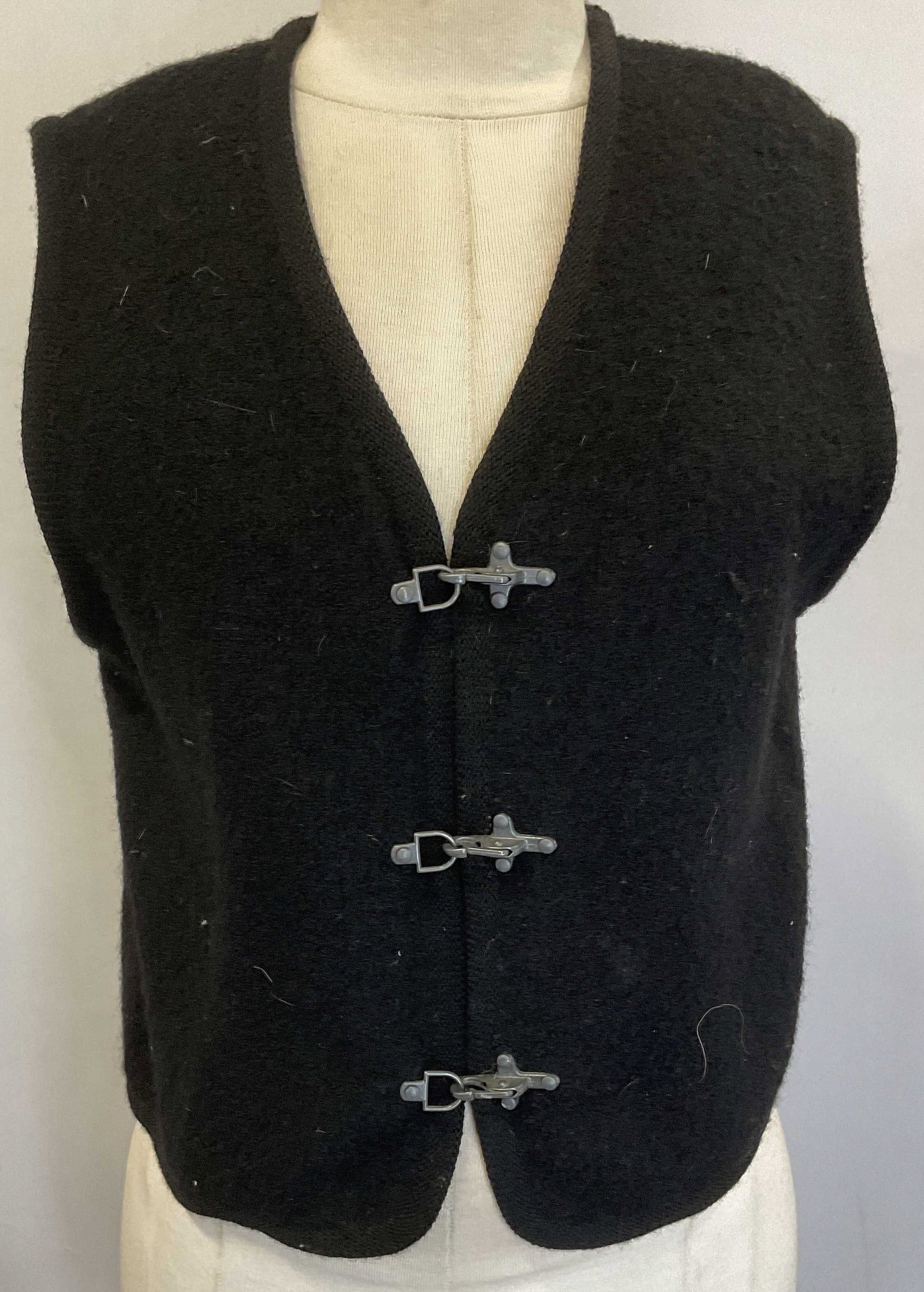 Vintage Ice Black Wool Sleeveless Vest: Label reads ICE 8 RN 85046 100%Wool Made in Hong Kong. Vintage Ice black wool sleeveless vest with metal hook front. Size 8. Some blemishes and pilling. Ice vest, designer vest, designer fashion, fall