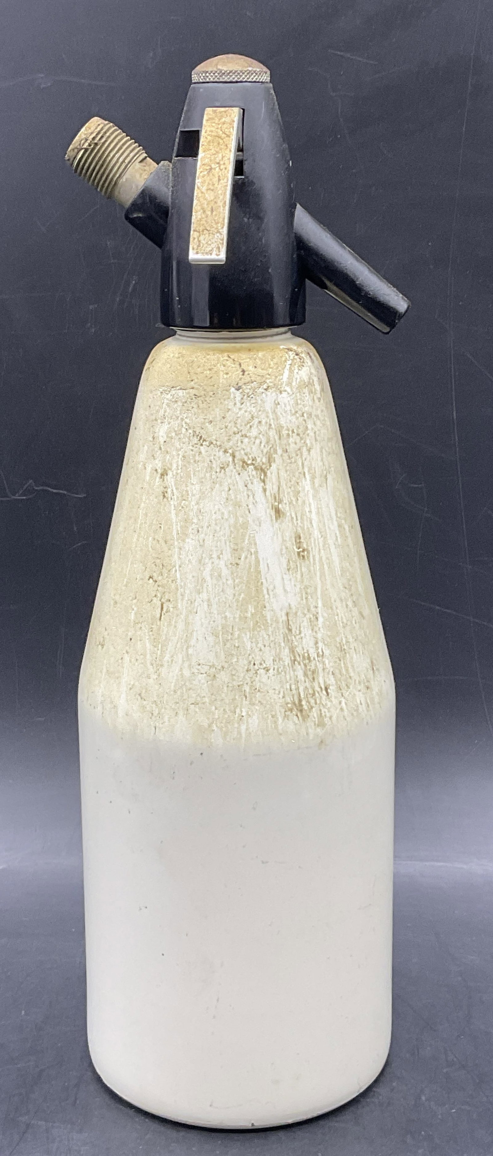 ISI AUSTRIA Vintage Metal Seltzer Bottle: ISI AUSTRIA Vintage Metal Seltzer Bottle. Underside reads ISI AUSTRIA. White hued body with a black top. Measures approx, 12.5H x 4W in. Appears to be stained / discolored. Surface wear, losses to pai