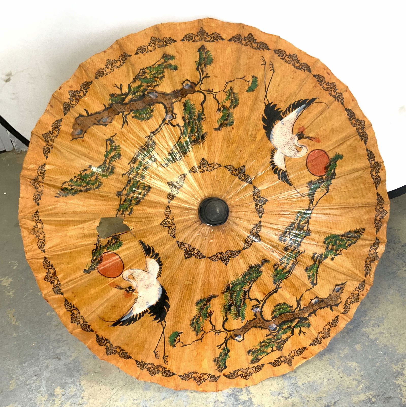 Vintage Hand Painted Asian Umbrella: Umbrella is vintage. Piece is hand painted with bonsai tree, sun and crane detail. Umbrella is tan toned. Piece has wooden handle. Measures approx 32 inches wide when open 25 inches tall. Umbrella, As