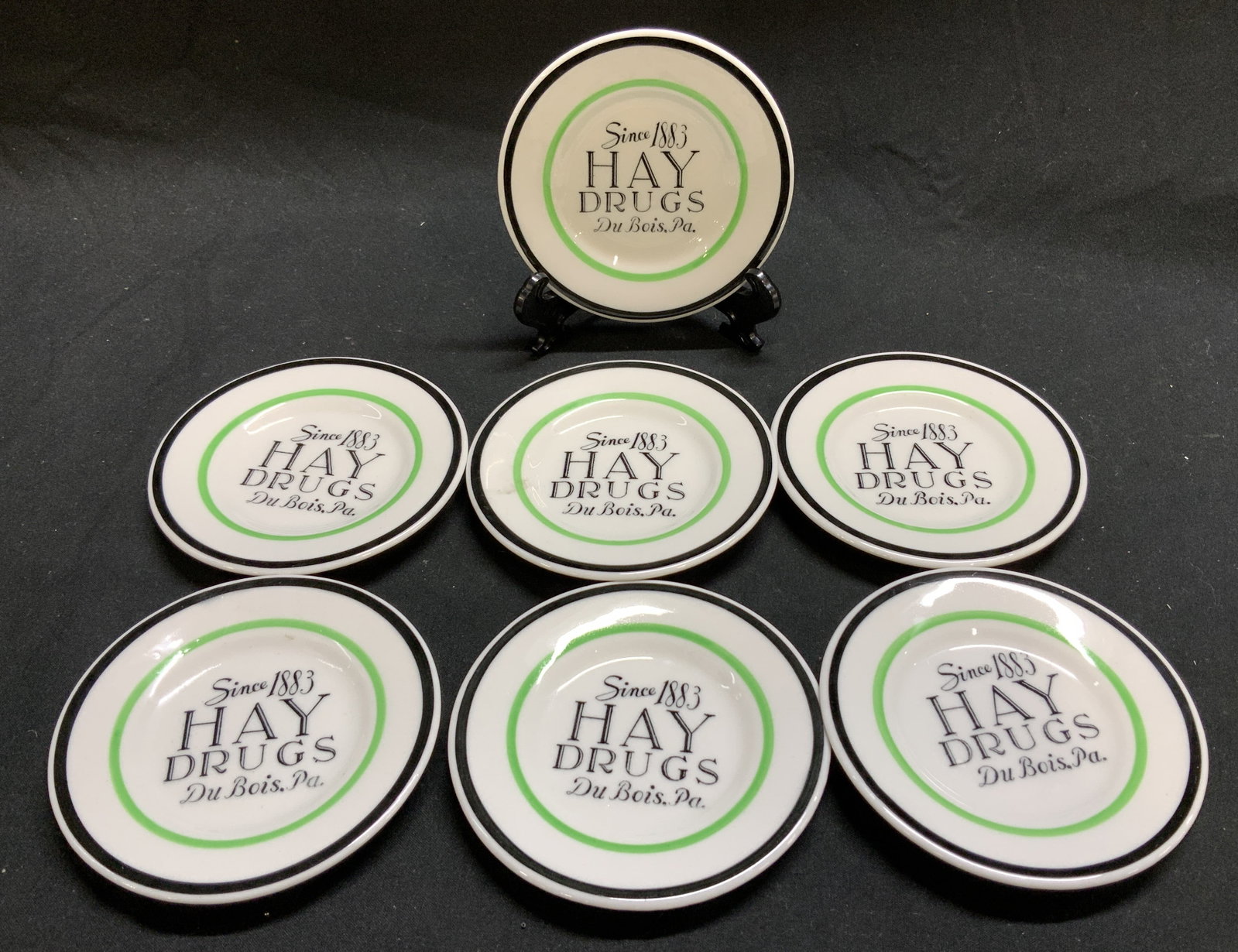 7 Hay Drugs Du Bois Pa Promo Trinket Dishes USA: 7+ Hay Drugs Du Bois, Pa. Promotional Trinket Dish Lot includes 7 porcelain trinket dishes. Trinket dishes feature a black trim & black lettering that reads: SINCE 1883 HAY DRUGS Du Bois, Pa. Signed &
