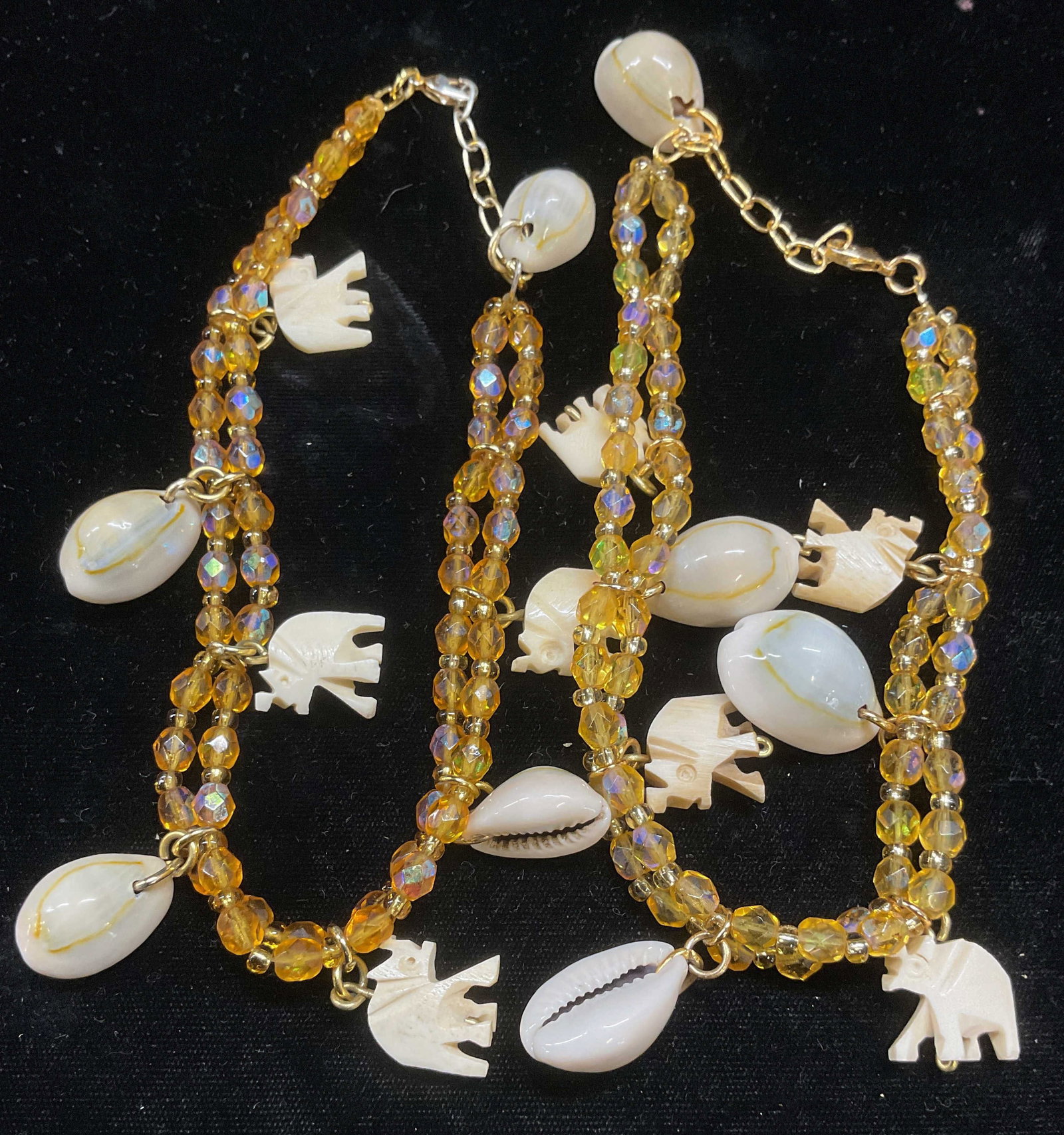 Pair Crystal Shell & Bone Elephant Necklaces: Pair of orange crystal, shell, and elephant motif bone choker necklaces. Drop length approx 6 inches each. Some wear including scratching observed. Jewelry, estate jewelry, costume jewelry, cocktail j