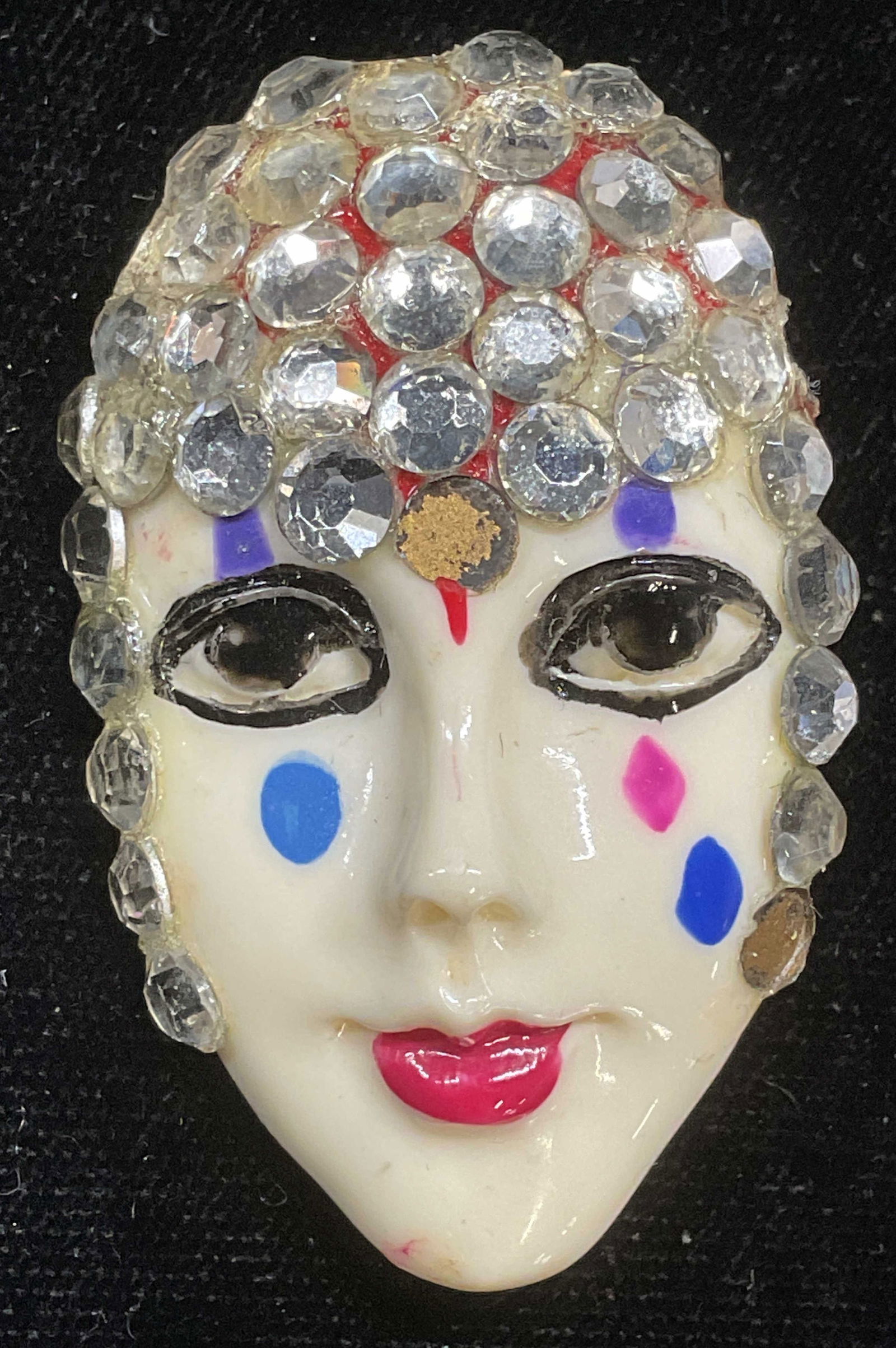 Vintage Flapper Head Lucite Crystal Brooch: Vintage hand painted lucite flapper motif brooch with crystals. Head of a woman. Measures approx 2 x 1 inches. Some scratching observed, missing crystals. Jewelry, estate jewelry, costume jewelry, fas