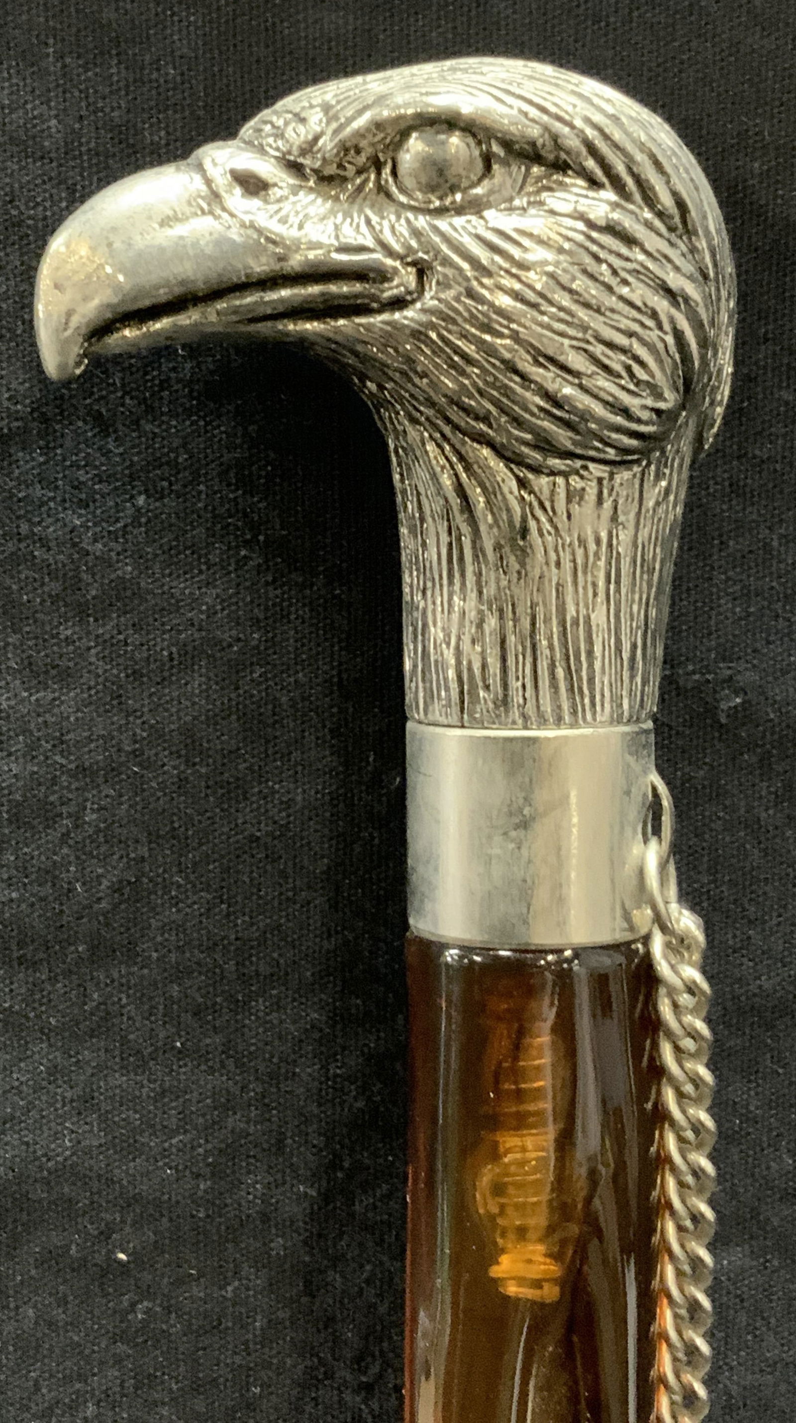 Eagle Handle Shoe Horn: Shoe horn with amber toned marbleized lucite and metal eagle form handle. Measures approx. 19 inches long. Some surface wear consistent with exposure. Shoe horn, eagle shoe horn, home accessories, hom