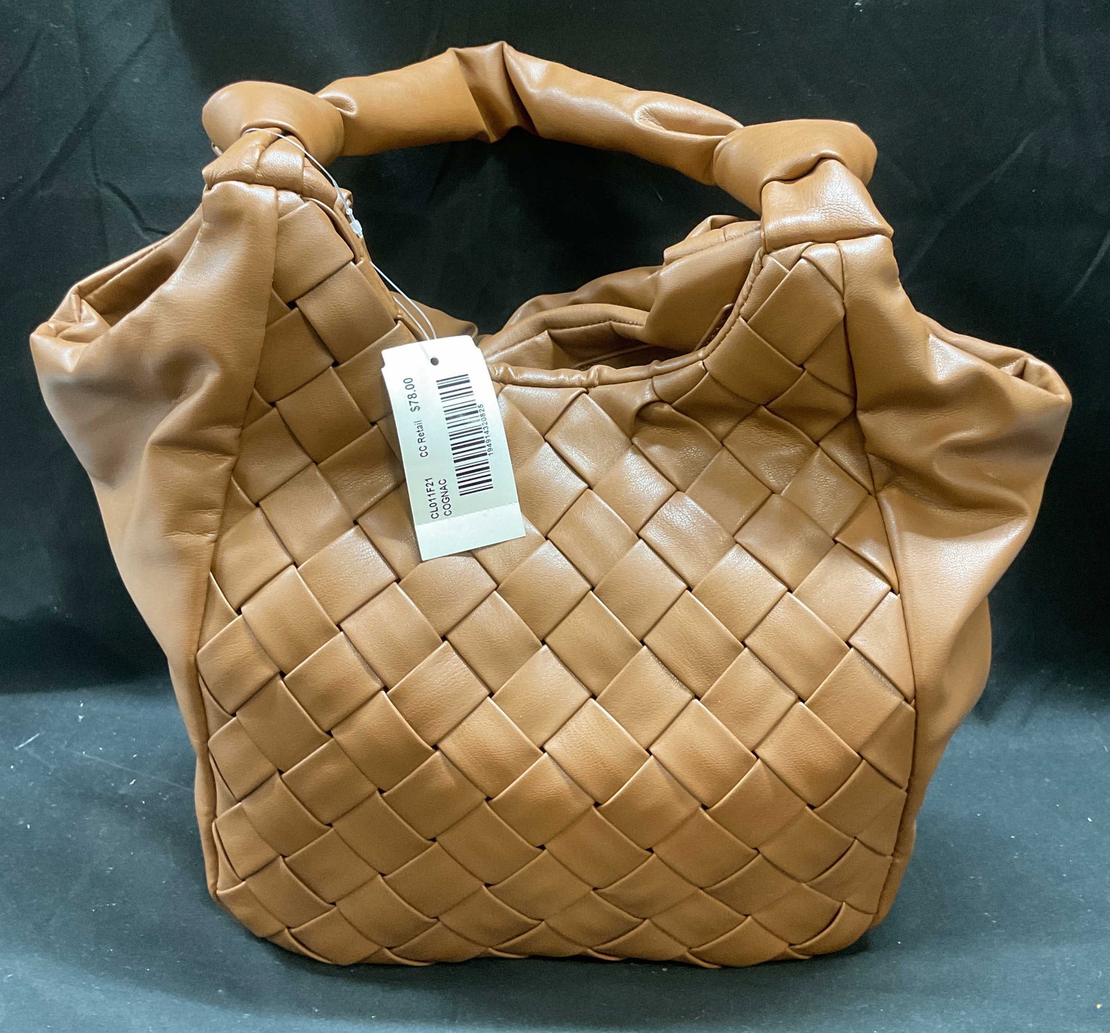 Brown Faux Leather Woven Handbag NWT: Brown faux leather handbag with woven design. Interior pocket. New with tag. Measures approx 10 x 5 x 10 inches. Some wear consistent with exposure. Brown handbag, faux leather handbag, woven handbag,