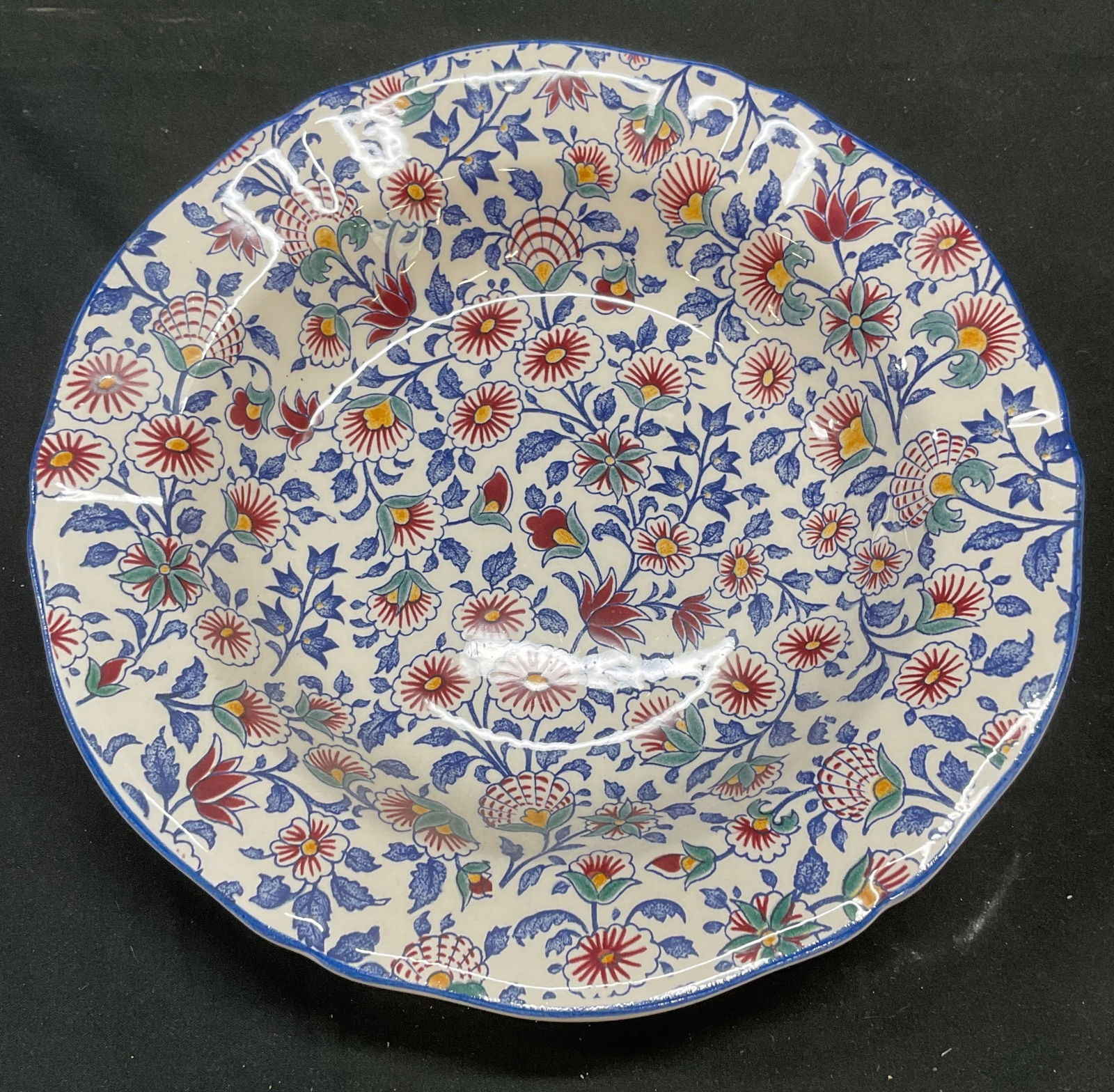 Gien Persepolis Floral Porcelain Bowl, France: Gien porcelain bowl. Persepolis pattern. Red and blue floral design. Scalloped rim. Signed. Made in France. Measures approx 9 x 1.75 inches. Some scratching. Gien France, Gien Persepolis, Gien bowl, f