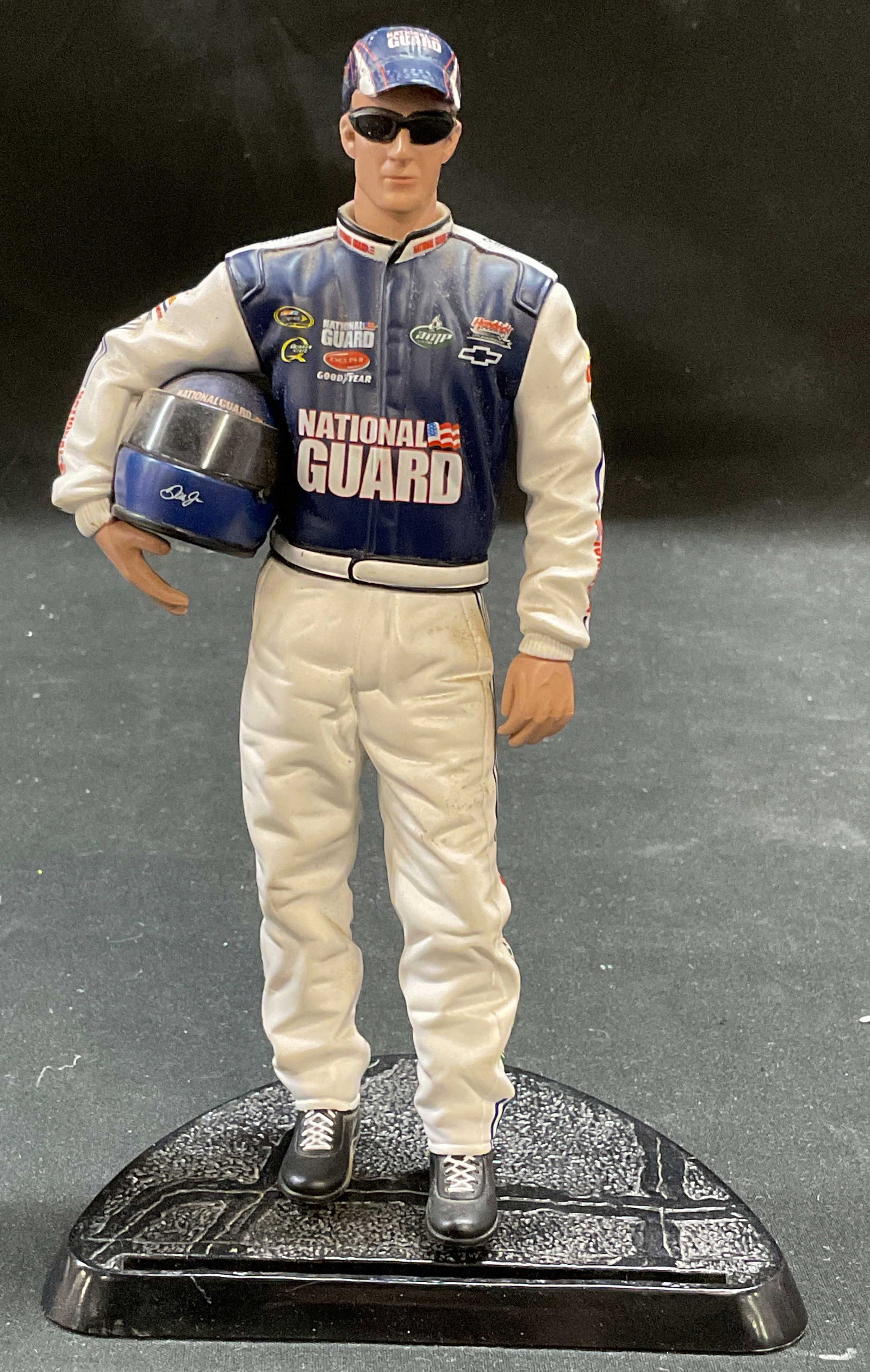 2009 Dale Earnhardt Jr NASCAR Motorsports Figurine: 2009 Dale Earnhardt Jr NASCAR Motorsports Authentics figurine with stand. Measures approx 7 inches tall. Composite material. Some wear consistent with exposure. NASCAR, nascar collectibles, nascar fig