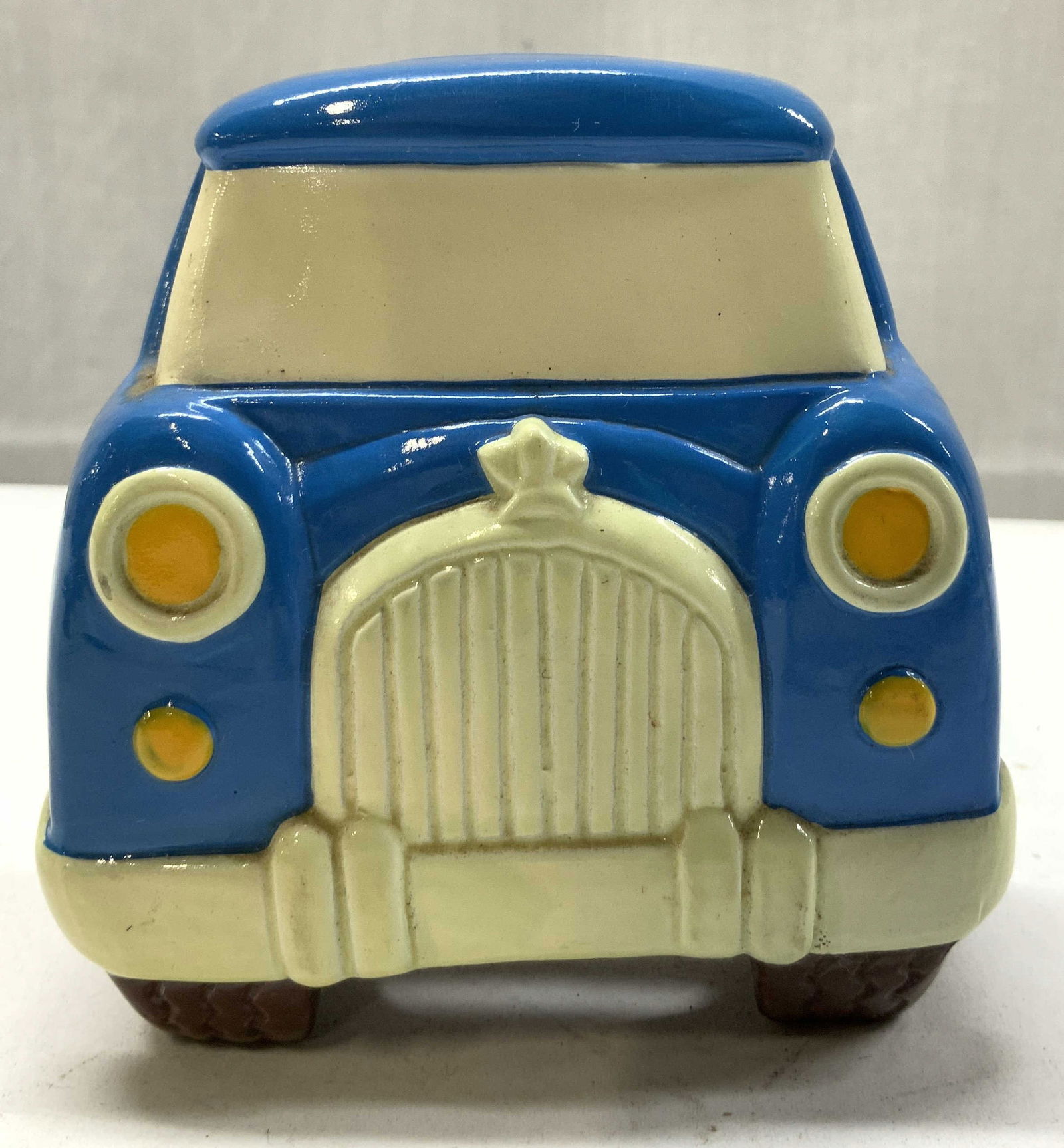 Vintage Blue Pickup Grill Ceramic Coin Bank: Vintage Blue Pickup Grill Ceramic Coin Bank Piggy bank in the shape of a vintage blue pickup truck. Piggy bank is ceramic & has a slot on the top. Surface wear consistent to age, use & exposure. Measu