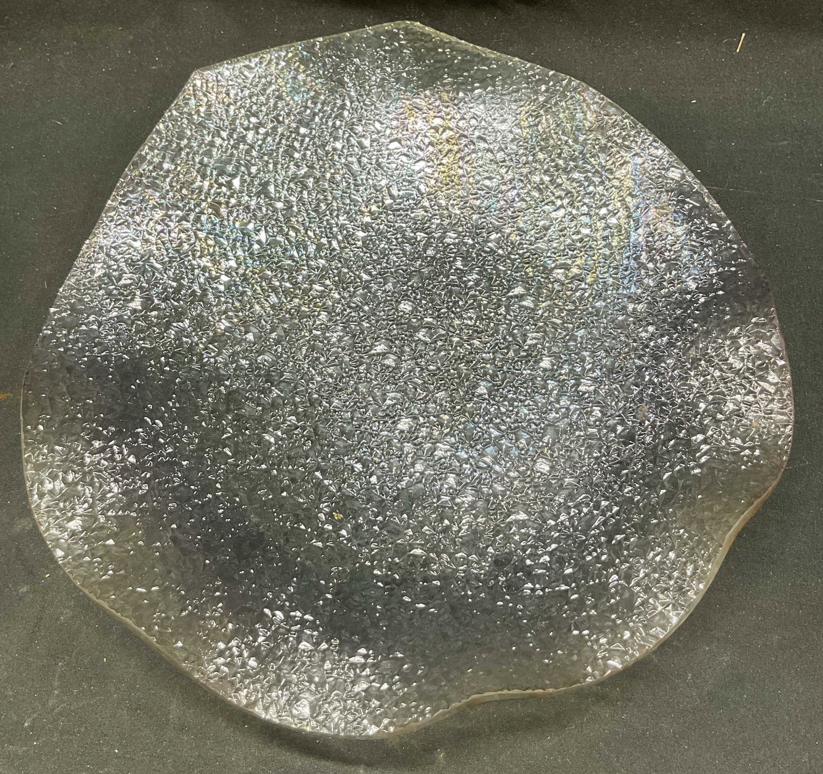 Vtg Clear Iridescent Glass Leaf Dinner Plate: Vintage clear iridescent glass leaf dinner plate. Glass with iridescent finish with pearl like luster. Abstract leaf shaped plate with textured surface design. Measures 9.25 x 8.5 inches. Some surface