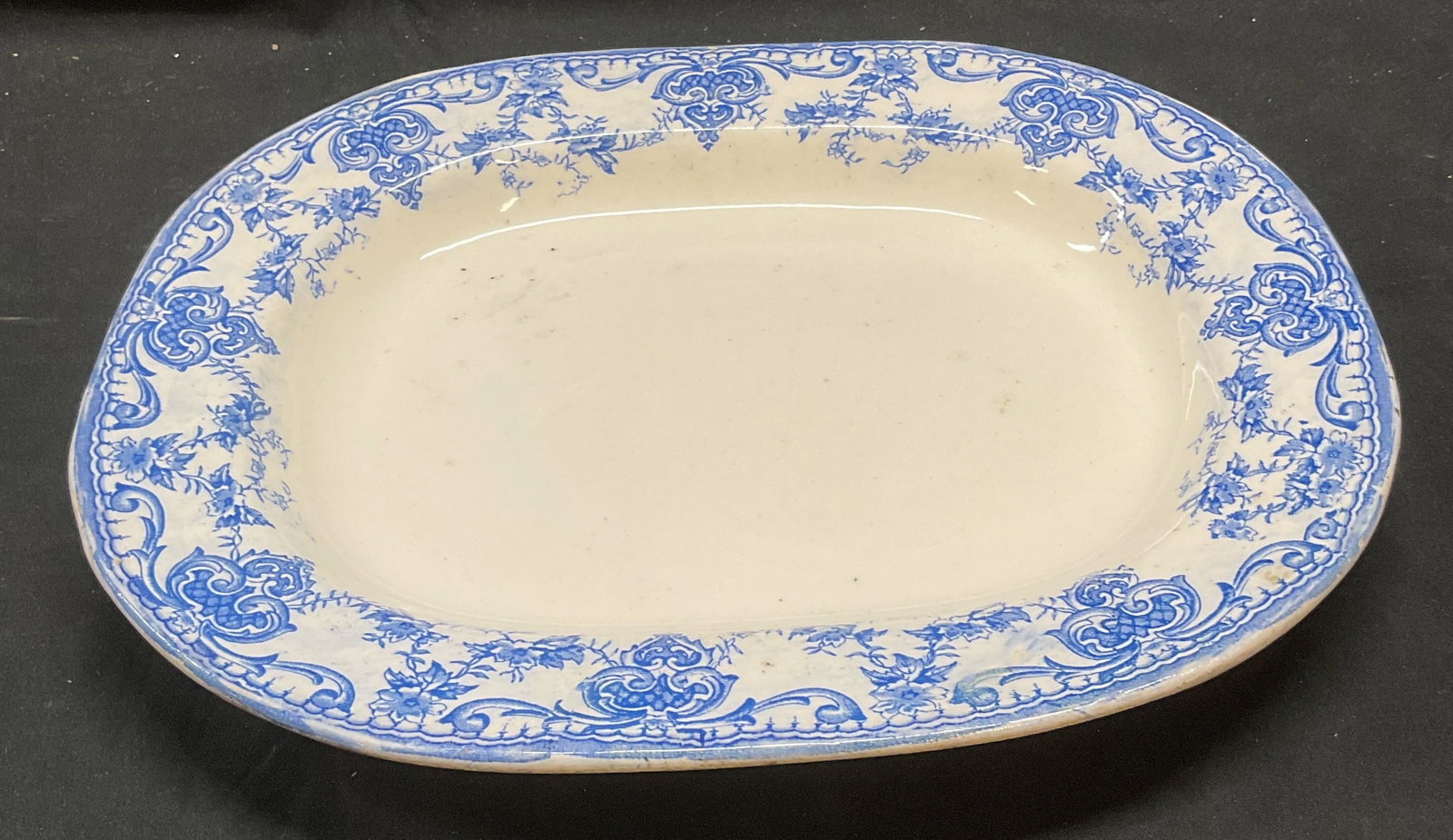 Vtg Doreen K & T L Blue & White Porcelain Platter: Vintage Doreen K & T L porcelain oval platter in blue and white. Transferware. Floral motif rim. Signed. Measures approx 13.5 x 11 inches. Some scratching and crazing. Doreen k and t l, vintage platte