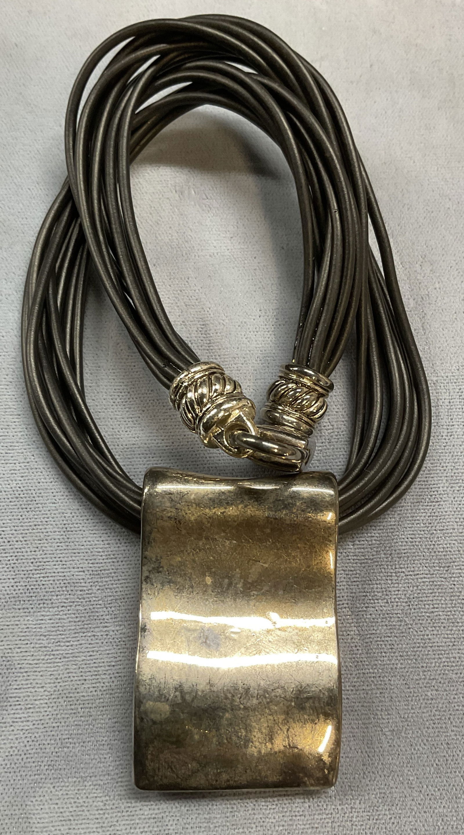 Silver Tone Modernist Choker Necklace: Modernist style choker necklace with silver tone pendant and clasp and multi strand black cord. Drop length approx 7 inches. Some scratching. Jewelry, estate jewelry, costume jewelry, cocktail jewelry