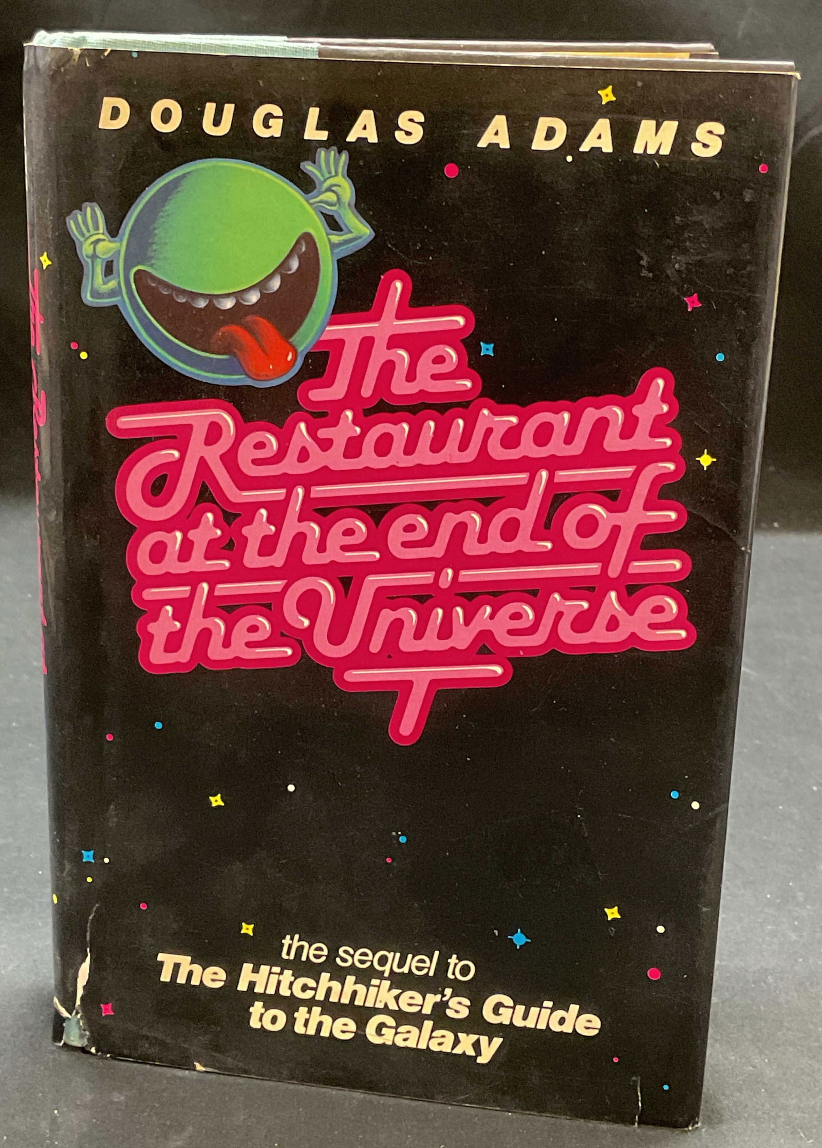 1st Ed Restaurant End of Universe, Adams, 1980: First edition hardcover The Restaurant At The End Of The Universe by Douglas Adams. Harmony Books, 1980. Sequel to The Hitchhikers Guide To The Galaxy. Measures approx 7.75 x 5 inches. Some wear to co