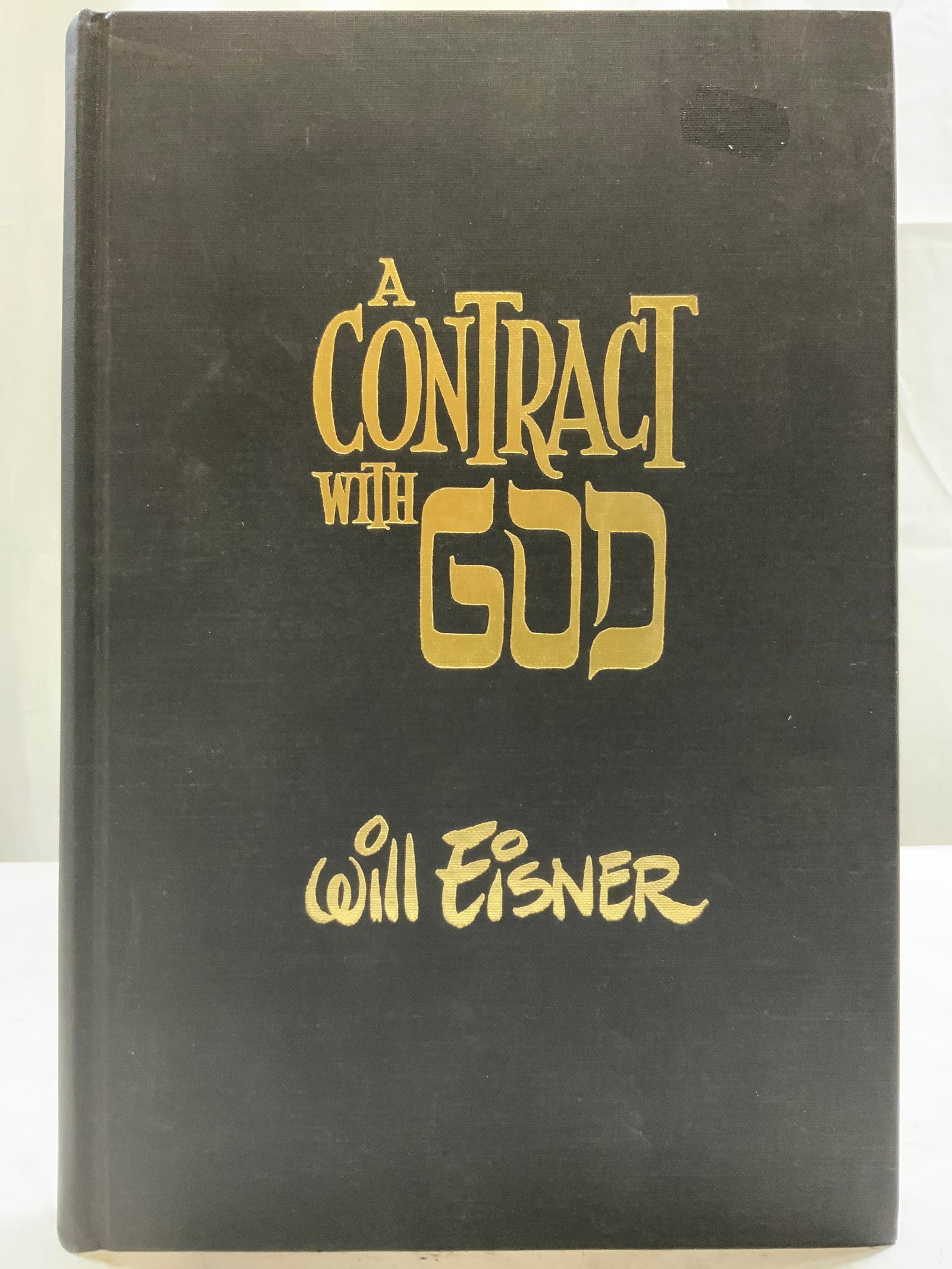 1978 A CONTRACT WITH GOD EISNER 1st Prnt Bk Illstr: Cover is black toned with gold toned lettering which reads A CONTRACT WITH GOD WILL EISNER. Book published in 1978 (Poorhouse Press). Vintage hardcover book. 100+ illustrations. First printing. Book m