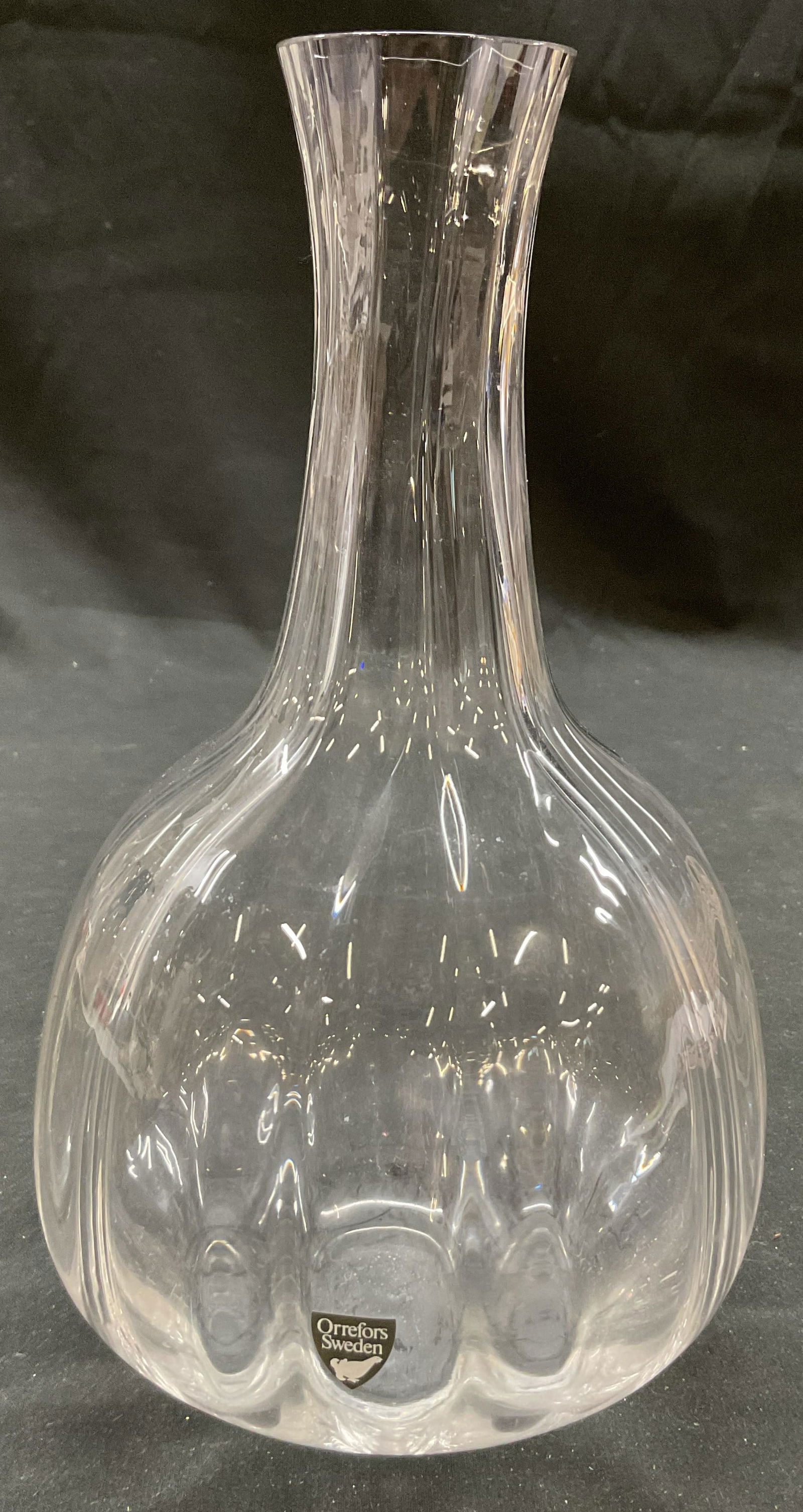 Vtg ORREFORS Faceted Glass Decanter Vase Sweden: Vintage ORREFORS hand blown faceted glass decanter vase. Wide base, tall narrow neck wine decanter. Could be used as vase. 9 x 4.5 inches. Sticker says ORREFORS Sweden. Made in Sweden. Some surface we