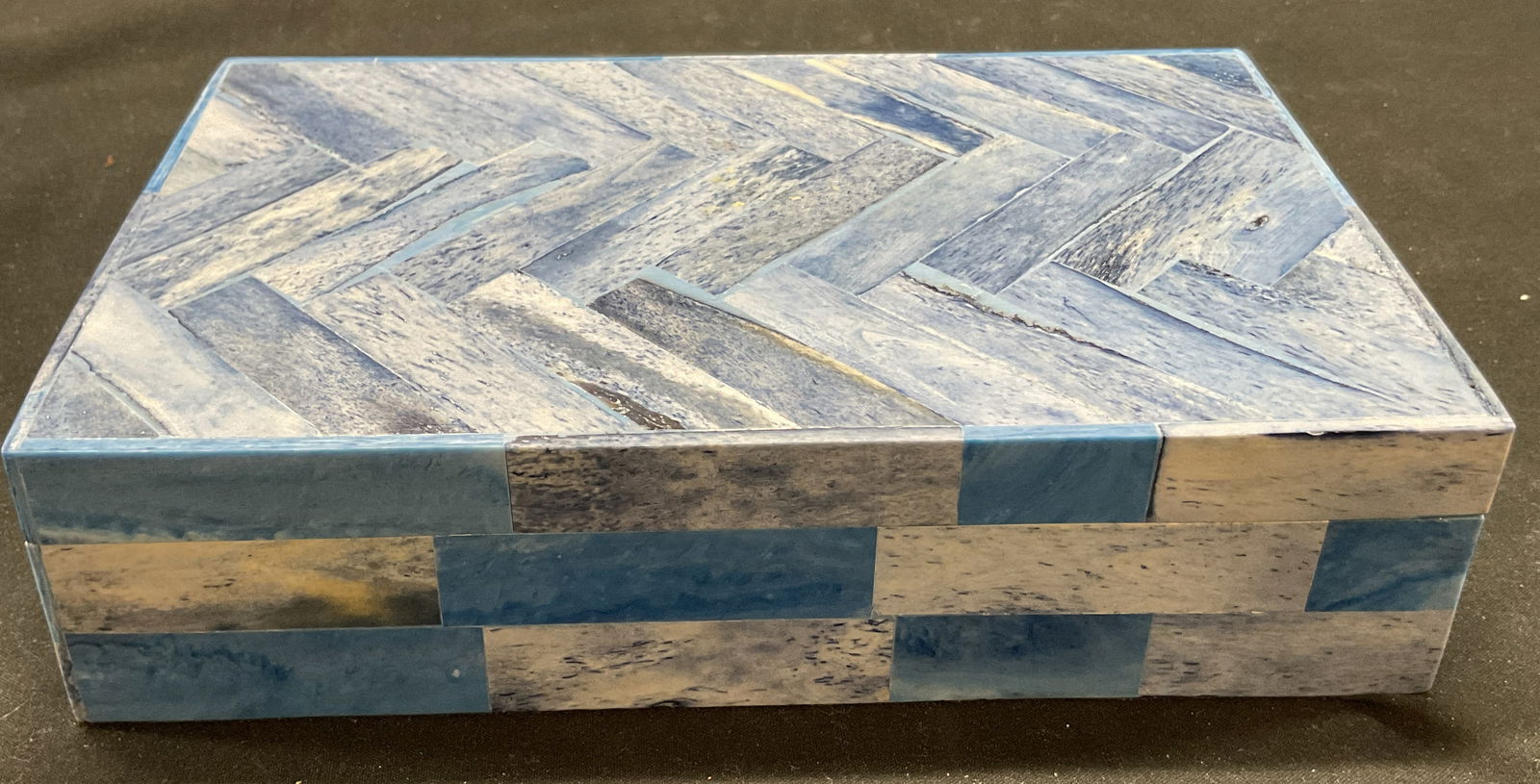 Vtg Chevron Patterned Wooden Bone Inlay Box India: Vintage chevron patterned wooden bone inlay jewelry box. Blue Chevron mosaic pattern design. Black velvet inner lining. Made in India. 8 x 5 x 2 inches. Some surface wear consistent with exposure. Jew