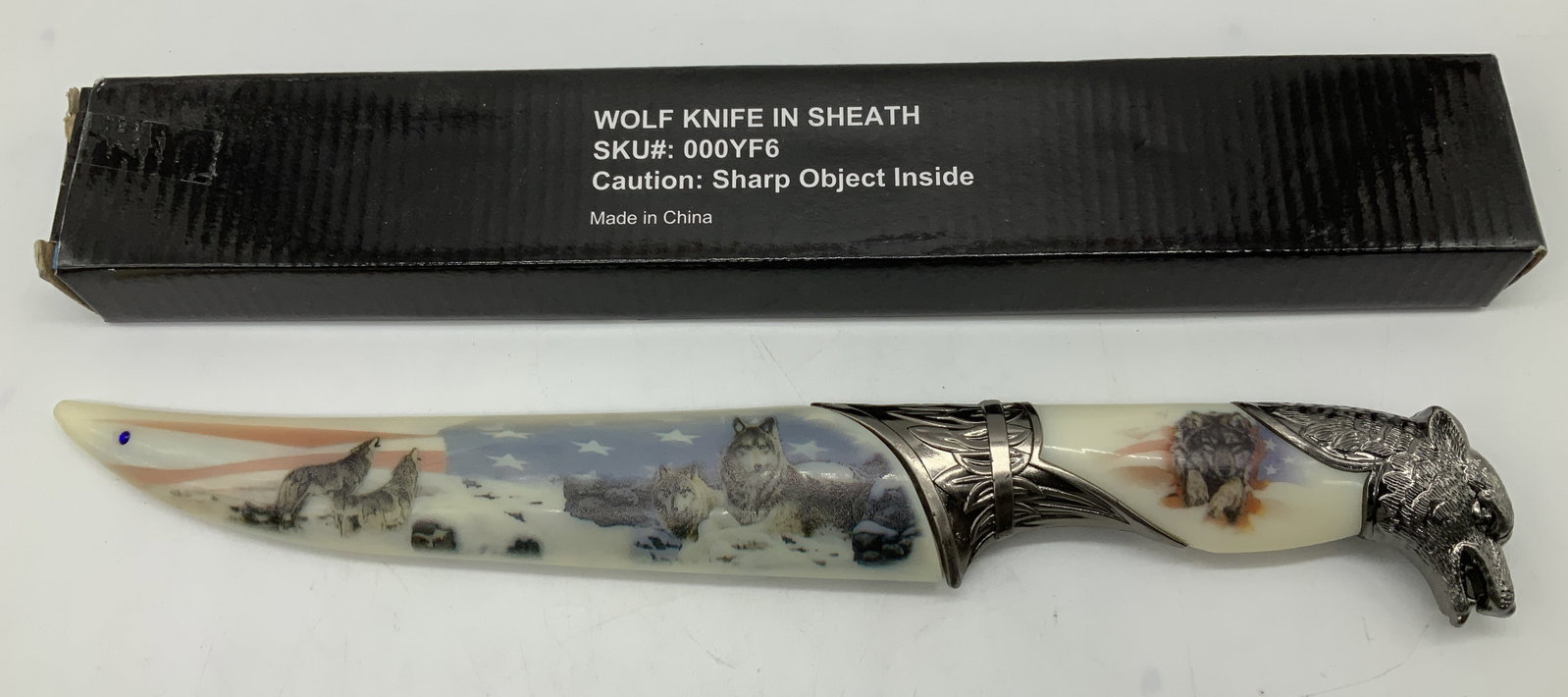 Patriotic Wolf Stainless Steel Knife In Sheath NIB: Patriotic Wolf Stainless Steel Knife In Sheath NIB Knife appears to be stainless steel & features multiple wolfs with an American flag motif in the background. Knife has a sheath. Surface wear consist