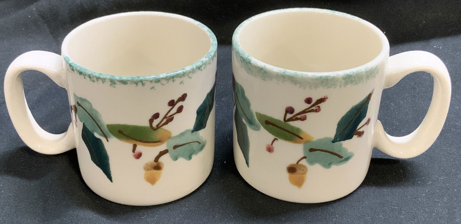Set 2 HARSTONE Woodland Ceramic Mugs USA: Set 2 HARSTONE Woodland Ceramic Mini Mug USA Lot includes set 2 of HARSTONE mini mugs. Mugs are ceramic & feature a woodland pattern. Pattern has hand-painted oak leaves, acorns, berries motifs. Surfa