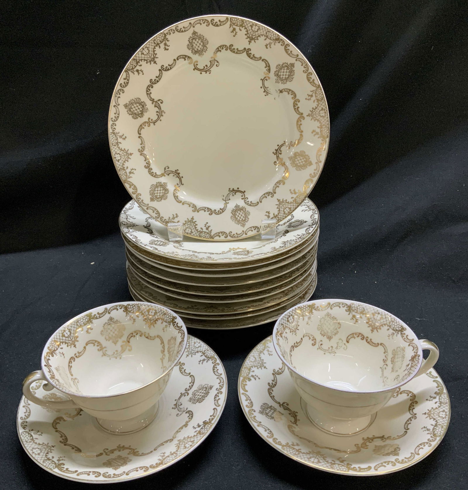 BAVARIA Gold Scrollwork Porcelain Teacups & Plates: BAVARIA Gold Scrollwork Porcelain Teacups & Plates 2 teacups, 2 saucer & 10 dinner plates. Pieces are porcelain & have gold detailing & a gold trim. Signed & marked on underside. Reads BAVARIA with cr