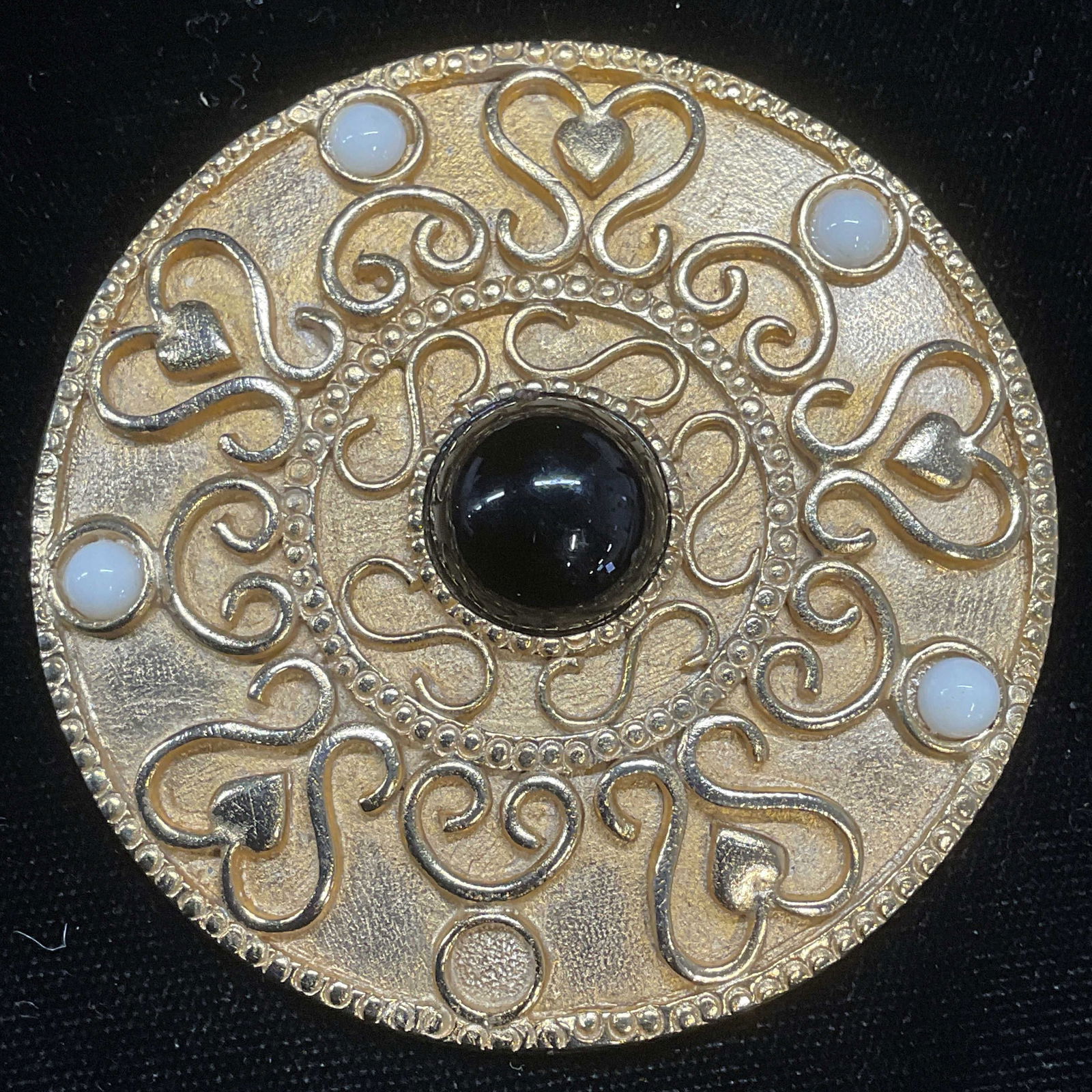 Vintage Gold Tone Lucite Brooch, 2.5 in W: Vintage gold tone filigree black and white lucite cabochons brooch. Measures approx 2.5 inches wide. Some wear including scratching observed. Jewelry, estate jewelry, costume jewelry, cocktail jewelry