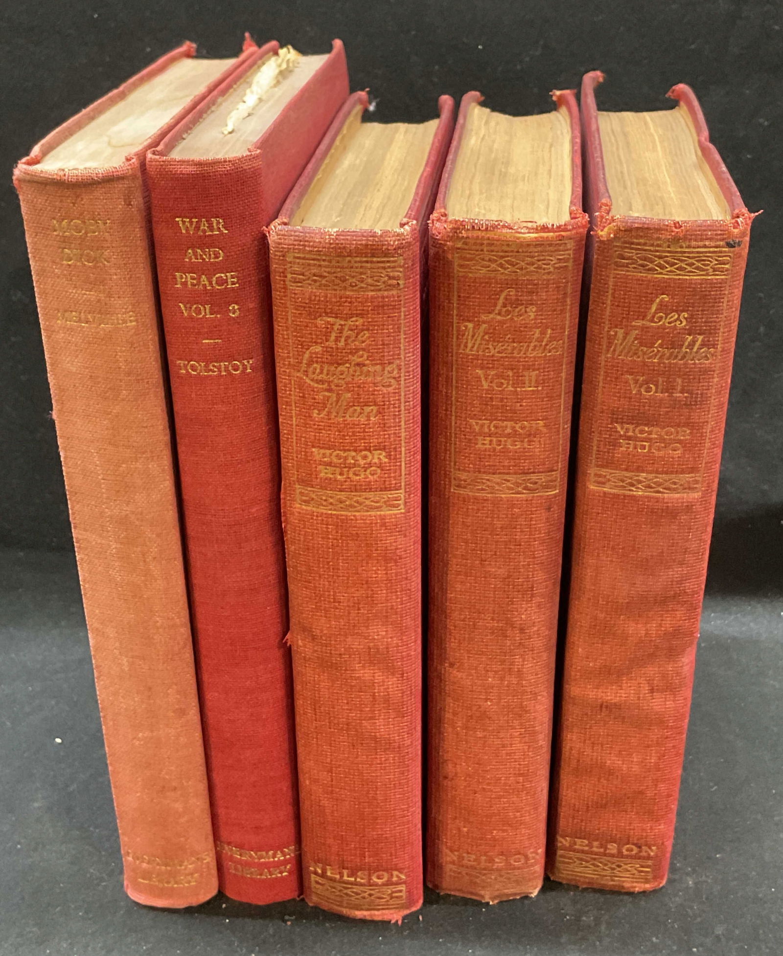 Lot 5 Vintage Everymans Library, Victor Hugo Books: Lot 5 antique Everymans library and Victor Hugo books. Lot includes Moby Dick by Herman Melville, War and Peace by Leo Tolstoy, The Laughing Man by Victor Hugo, Les Miserables volumes one and two by V