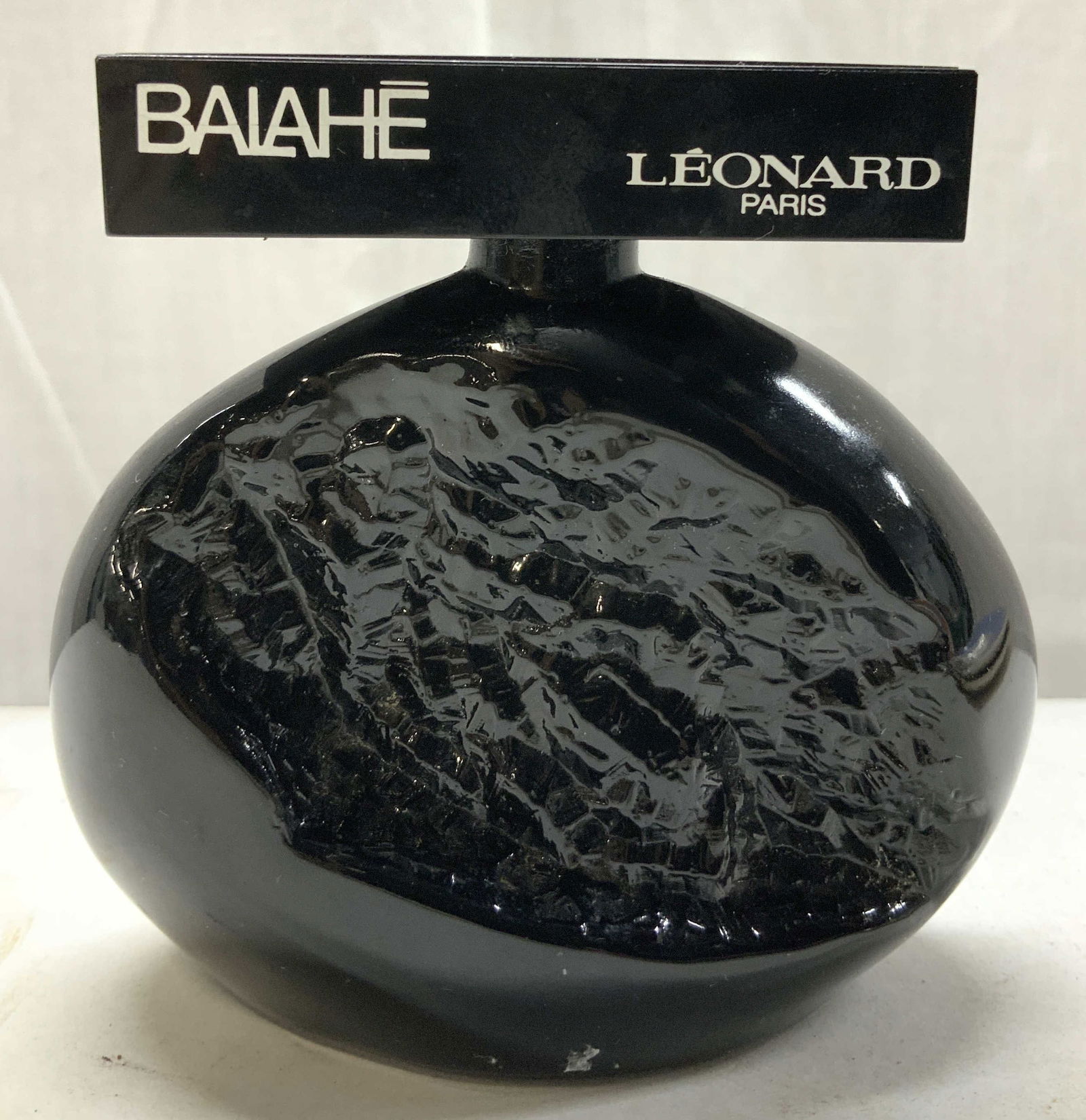 Balahe Leonard Eau de Toilette Fragrance FRANCE: Balahe Leonard Eau de Toilette Fragrance FRANCE Fragrance bottle has a black obsidian color glass & features an abstract/textured form. Bottle doesnt have perfume. Signed & marked. Reads BALAHE LEONAR