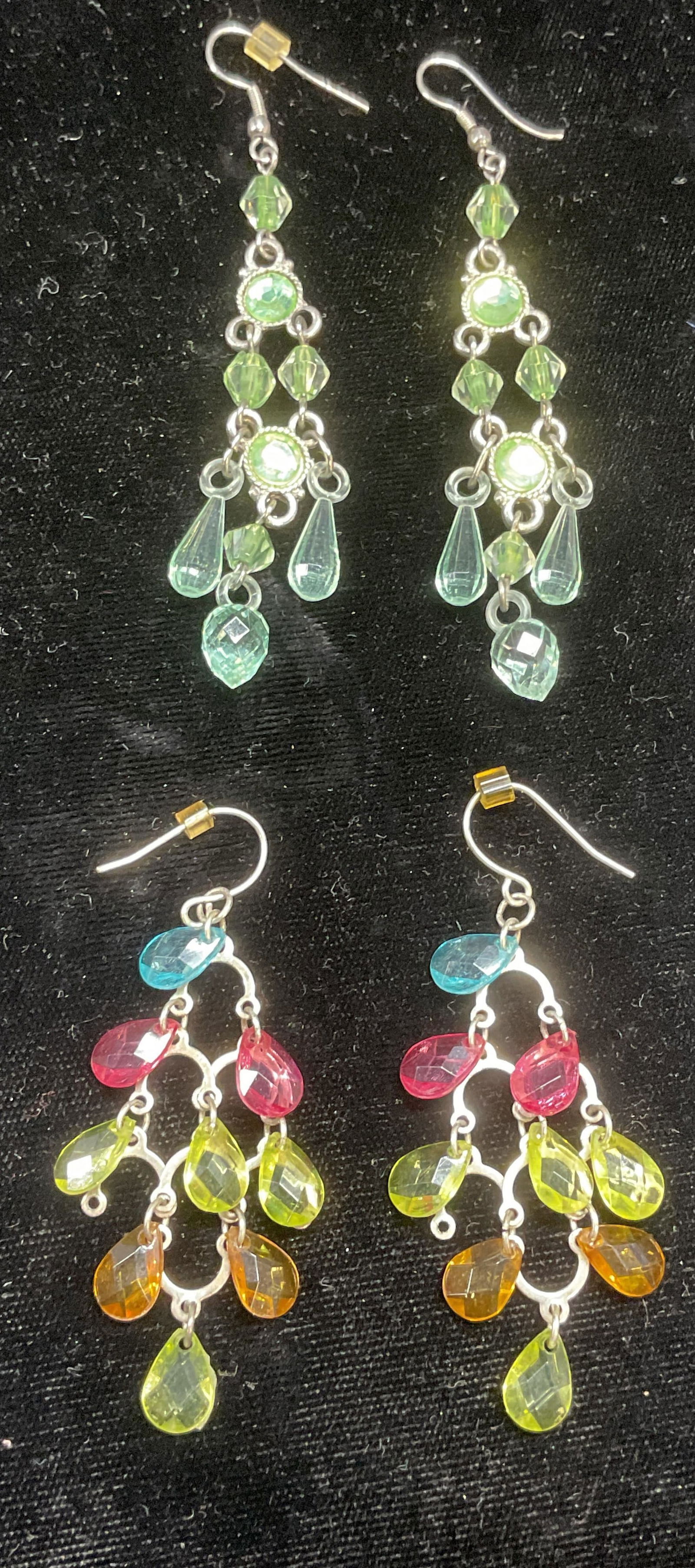Lot 2 Vintage Crystal Chandelier Earrings: Lot of 2 pairs of vintage crystal chandelier earrings. Multicolor and blue/green. Larger pair measure approx 3 inches long. Some wear including scratching observed. Jewelry, estate jewelry, costume je