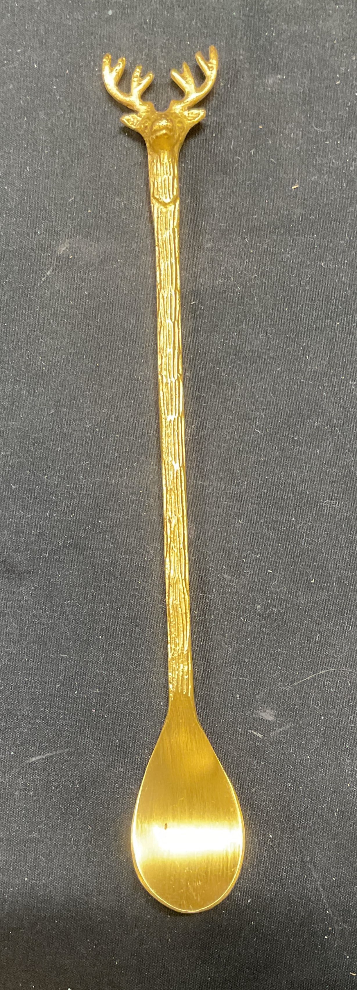 Brass Reindeer Cocktail Ice Cream Spoon: Brass reindeer head cocktail or ice cream spoon. Textured detail. Measures approx 8 inches long. Some wear consistent with exposure. Reindeer spoon, cocktail spoon, ice cream spoon, bar spoon, tablewa