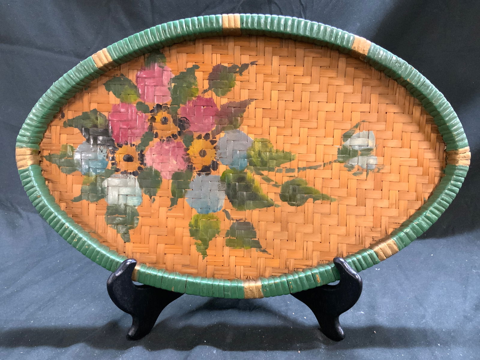 Vtg Hand Painted Wicker Burmese Basketry Sieve: Basketry sieve is vintage. Sieve is hand painted with multi toned floral and leaf detailed and green & gilt toned raised rim. Burmese basketry sieve appears to be woven wicker. Measures approximately