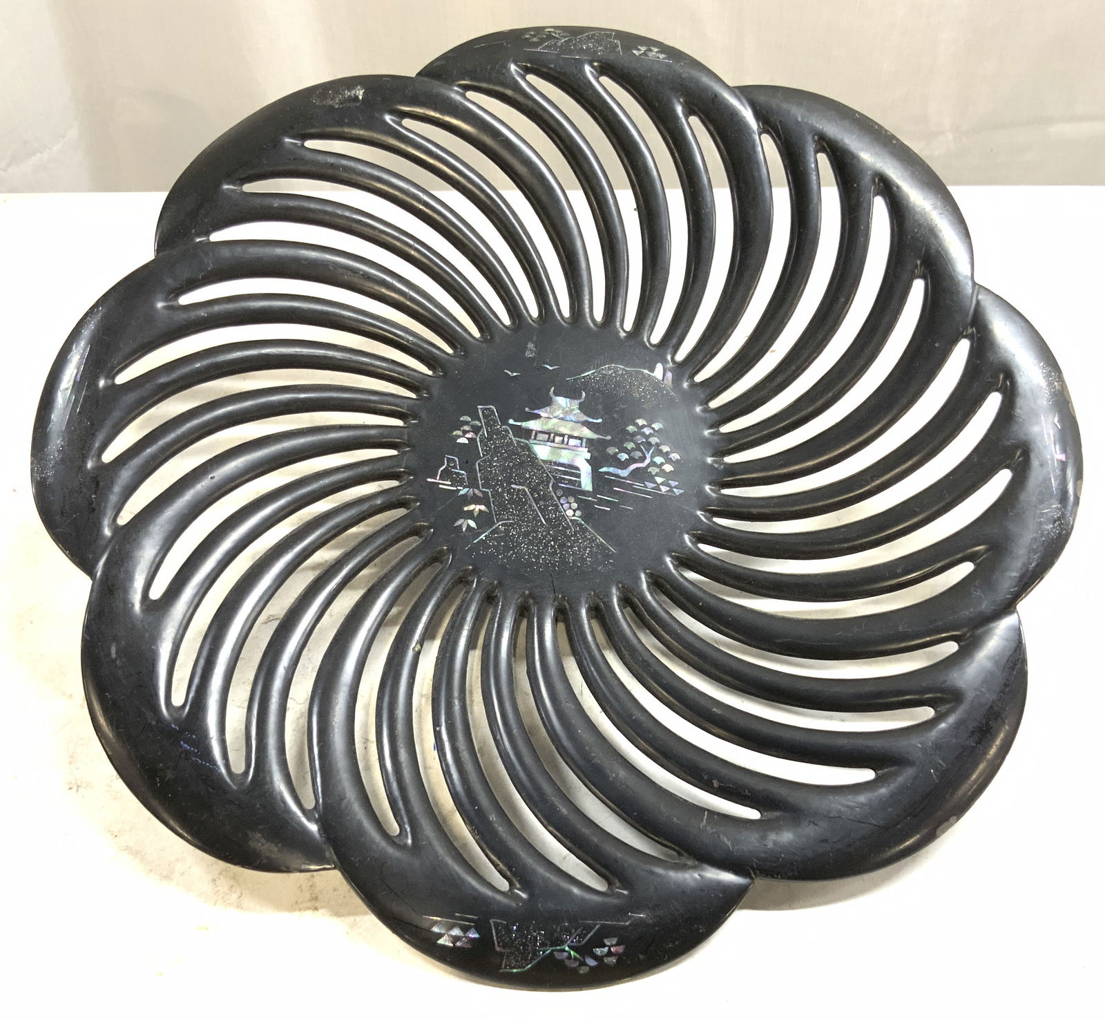 MARUNIWARE Hand Md MOP Lacq Metal Swirl Plate Japan: Underside is marked MARUNIWARE MADE BY HAND IN JAPAN MARUNIKOGYO TOKYO. Plate is black toned lacquered metal with mother of Pearl detail of landscape with Asian architecture. Plate has floral swirl fo