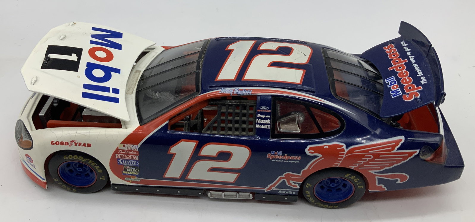 NASCAR 2000 #12 Mayfield Mobil Die-Cast Metal Car: NASCAR 2000 #12 Mayfield Mobil Die-Cast Metal Car 1:24 die-cast metal replica of Jeremy Mayfield #12 MOBIL 1 NASCAR race car. Car features sponsorships of Mobil 1, Gatorade, MOOG, NASCAR, Simpson & mo